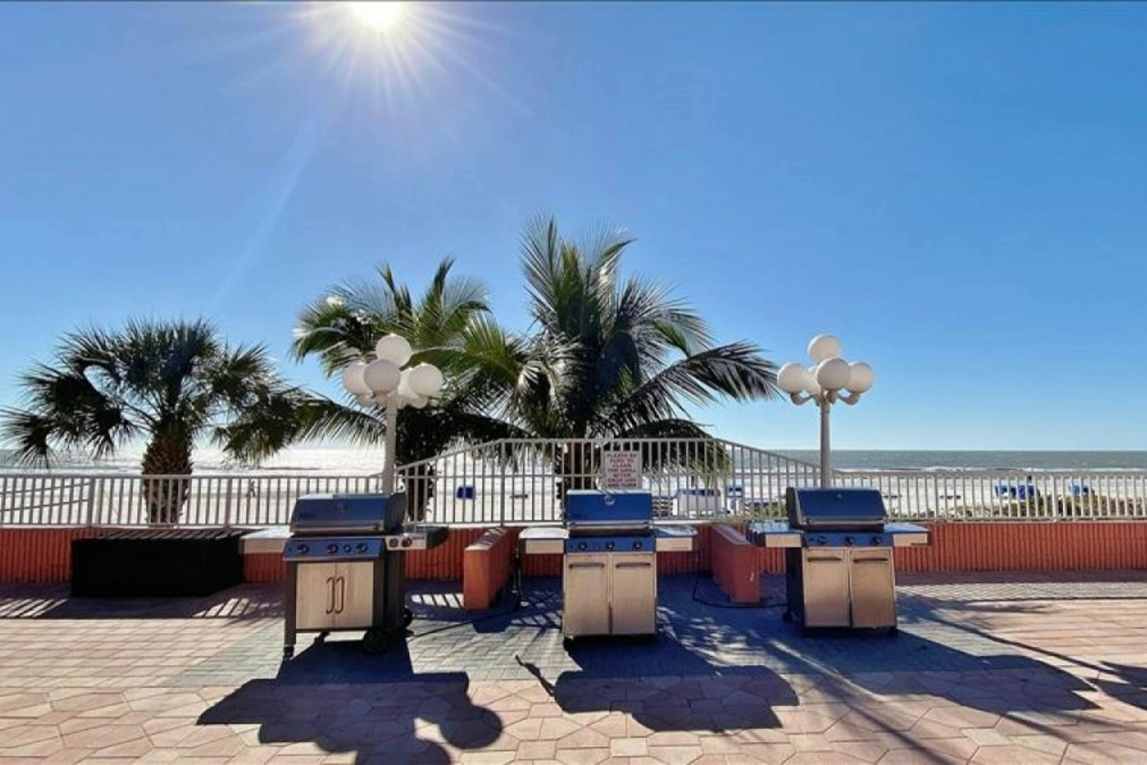 Modern cottage with peek-a-boo side Gulf view & beachfront heated pool & spa