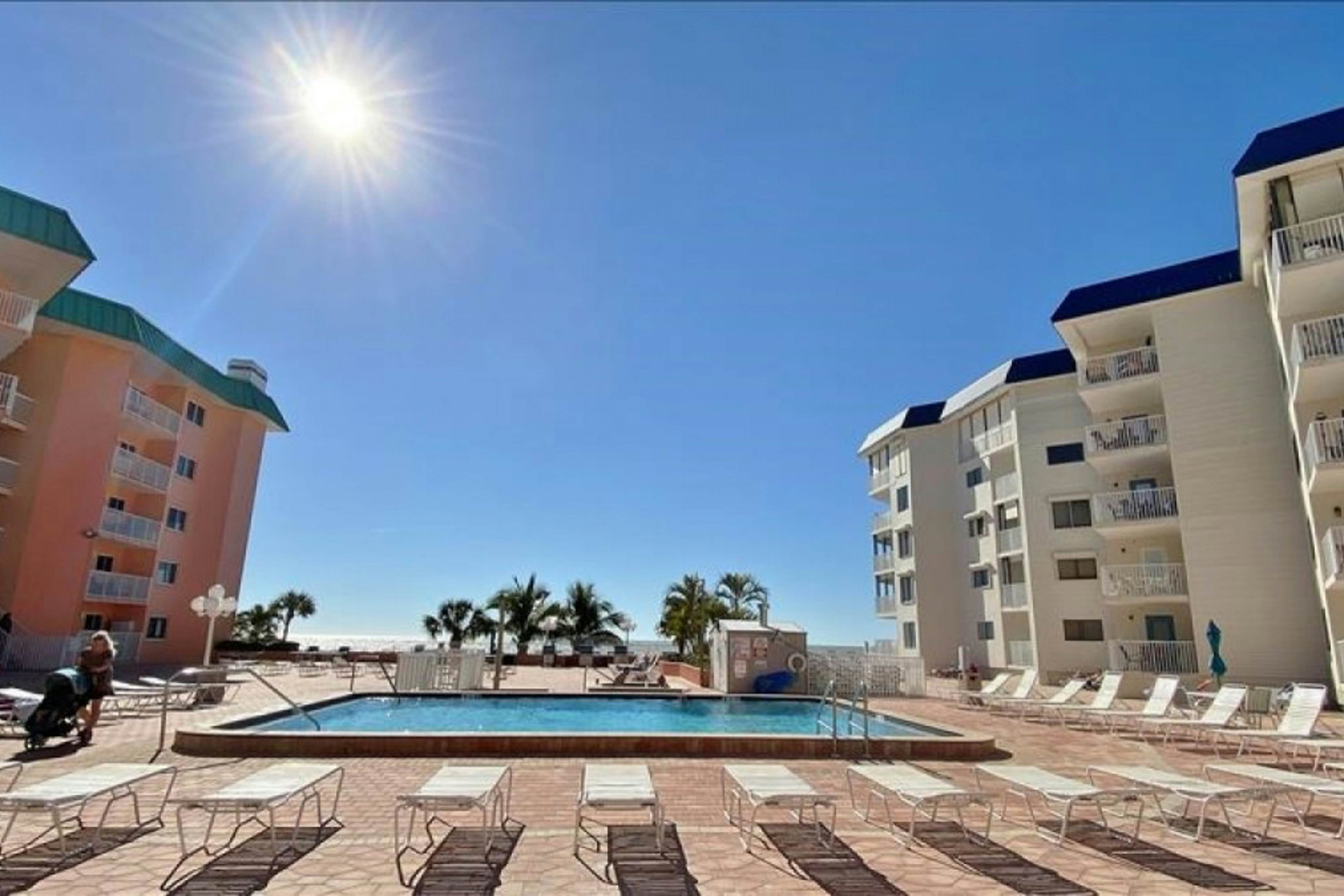 Modern cottage with peek-a-boo side Gulf view & beachfront heated pool & spa