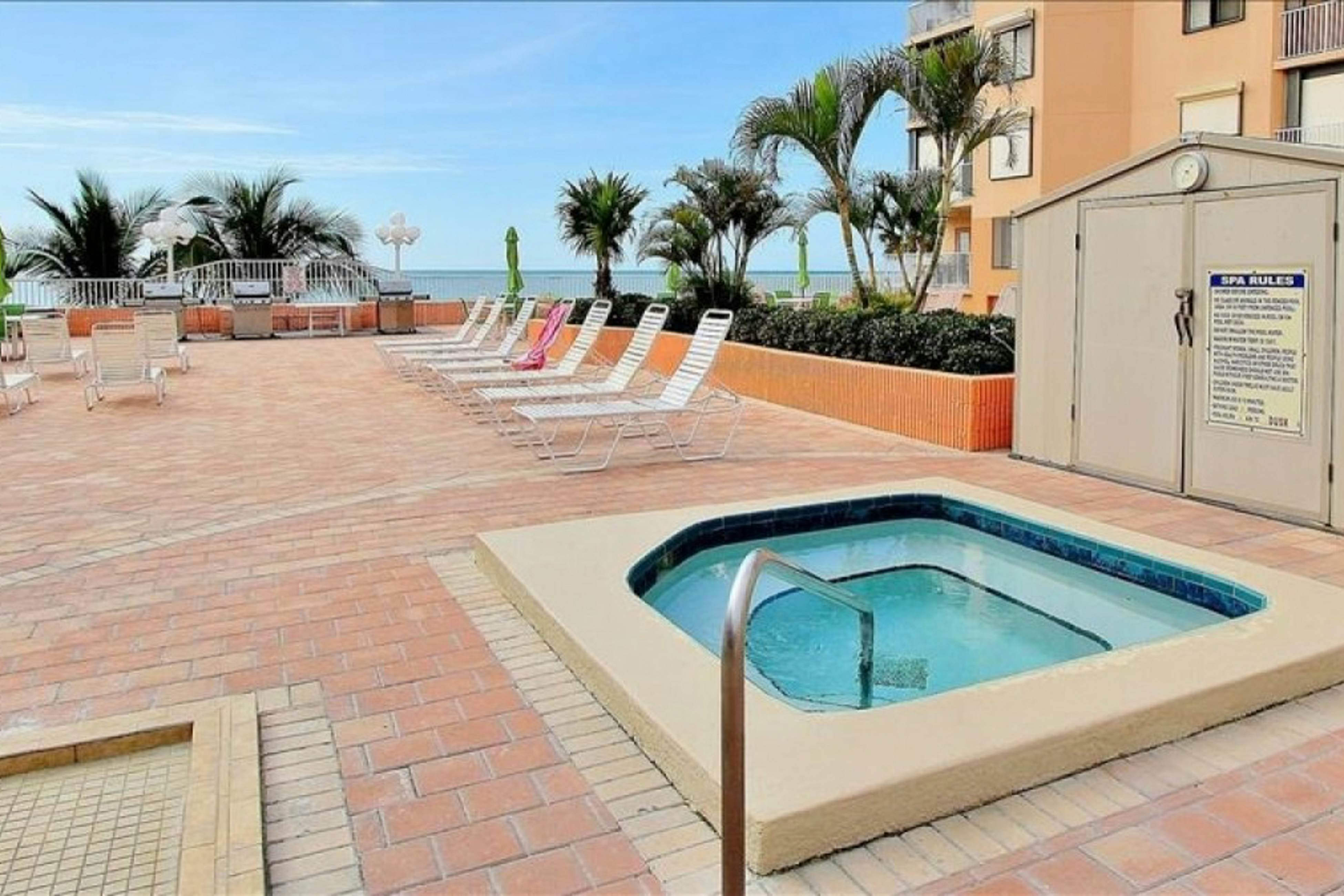 Modern cottage with peek-a-boo side Gulf view & beachfront heated pool & spa