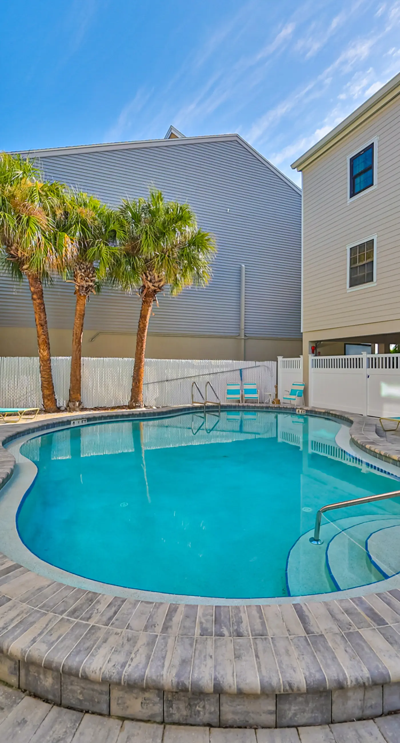Spacious and family friendly with pool dock and just steps to the beaches
