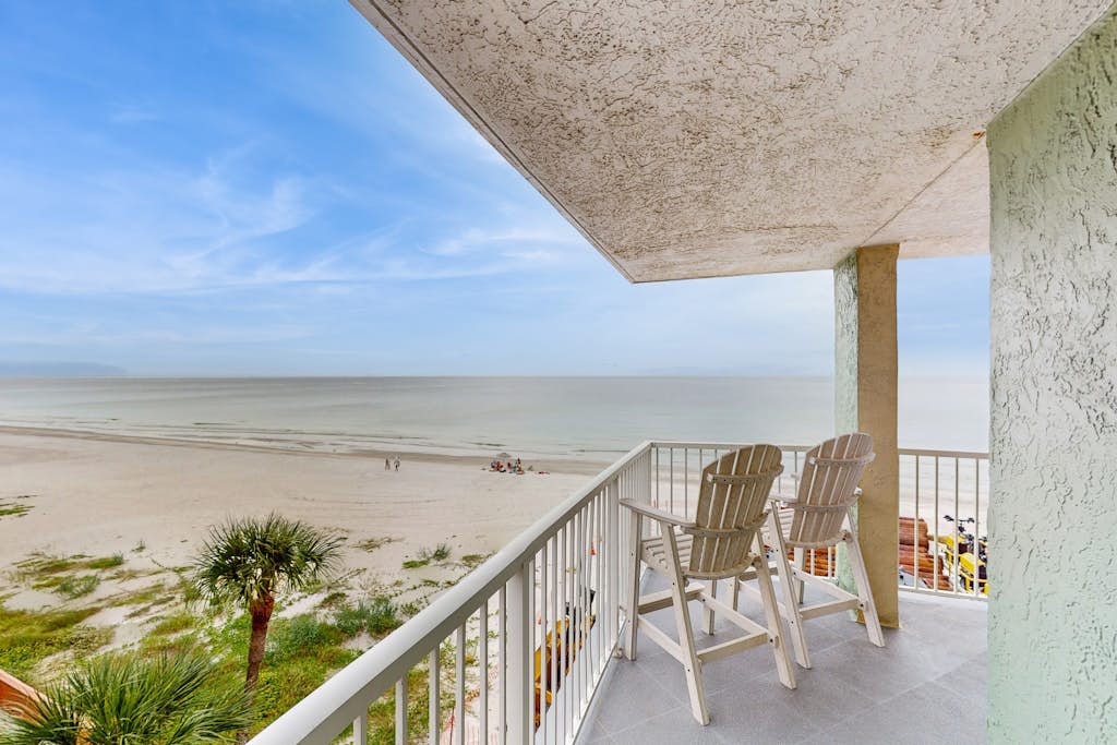 Coastal condo with sweeping Gulf views and wraparound balcony dogs welcome