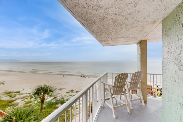 Coastal condo with sweeping Gulf views and wraparound balcony dogs welcome