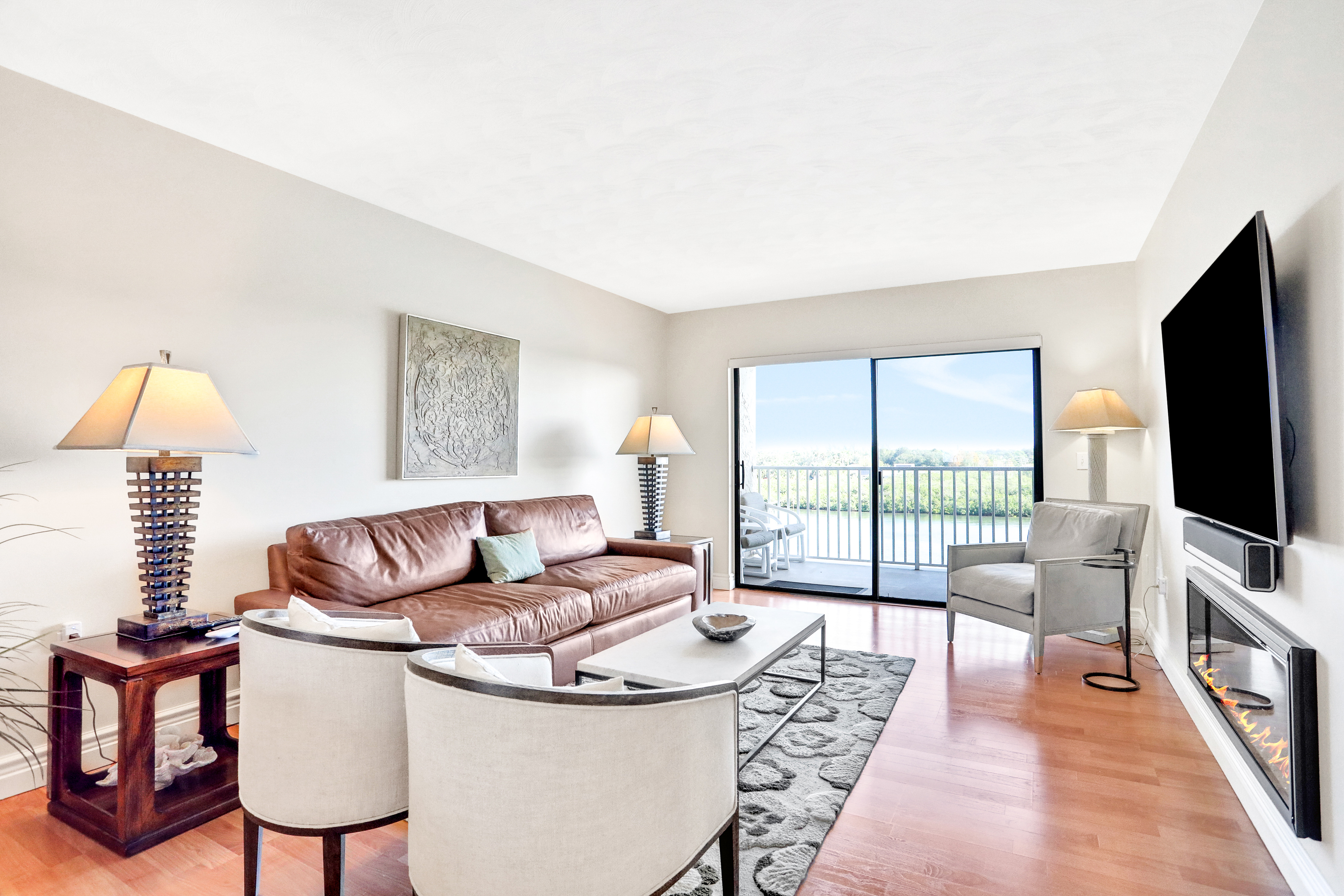 Elegant condo with water view near beach pool and hot tub fast WiFi and AC