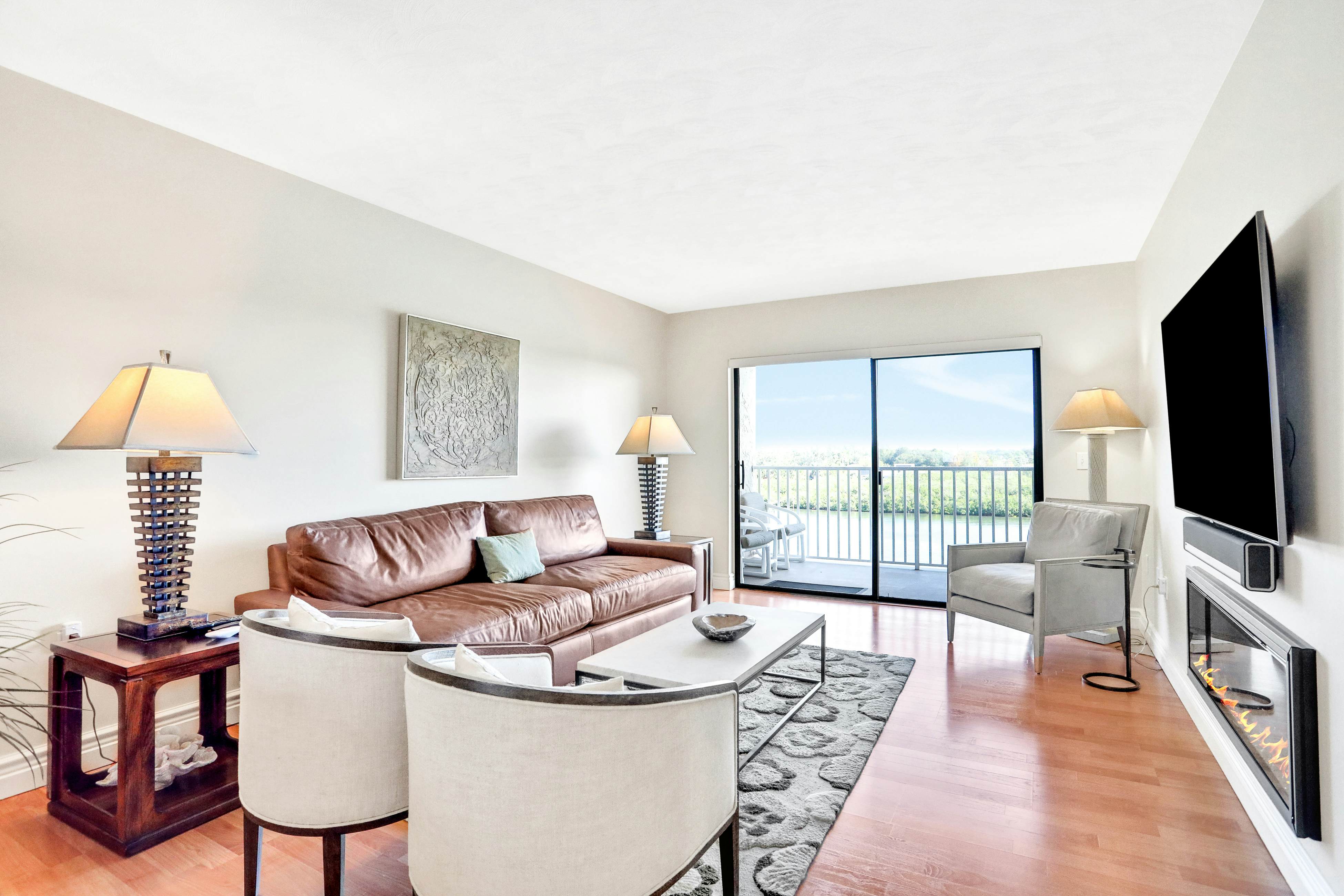 Elegant condo with water view near beach - pool & hot tub, fast WiFi & AC