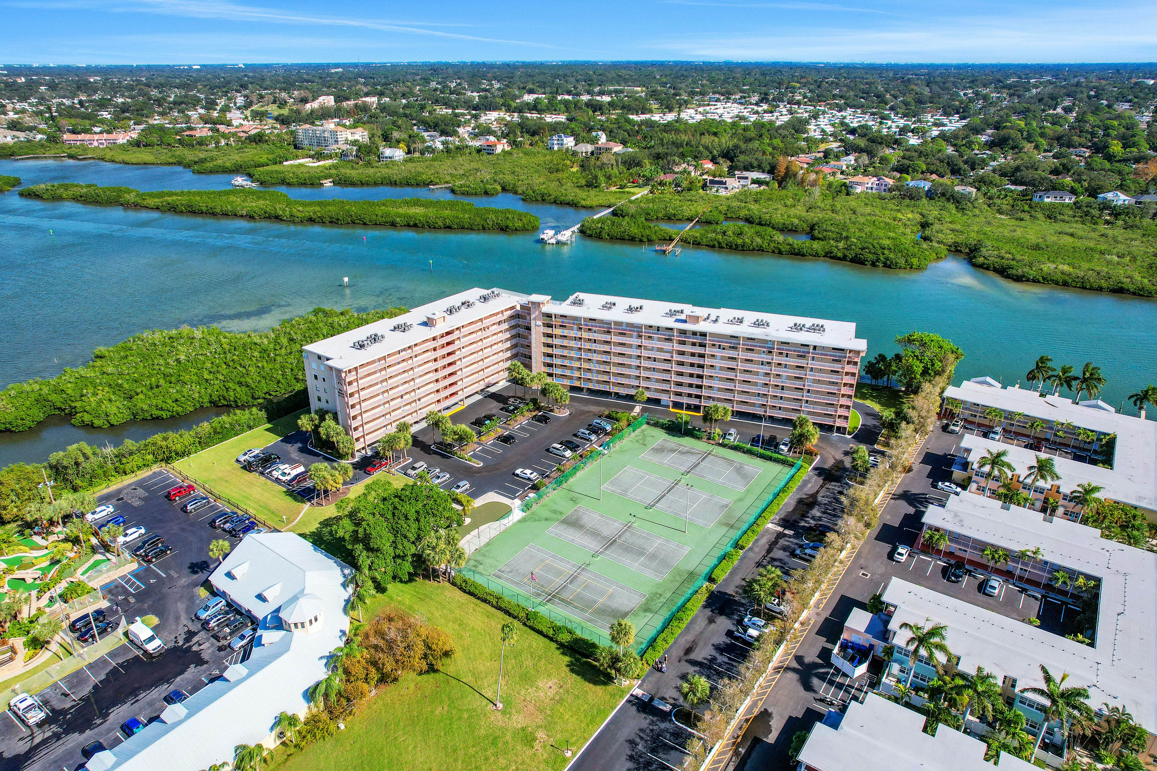 Elegant condo with water view near beach - pool & hot tub, fast WiFi & AC