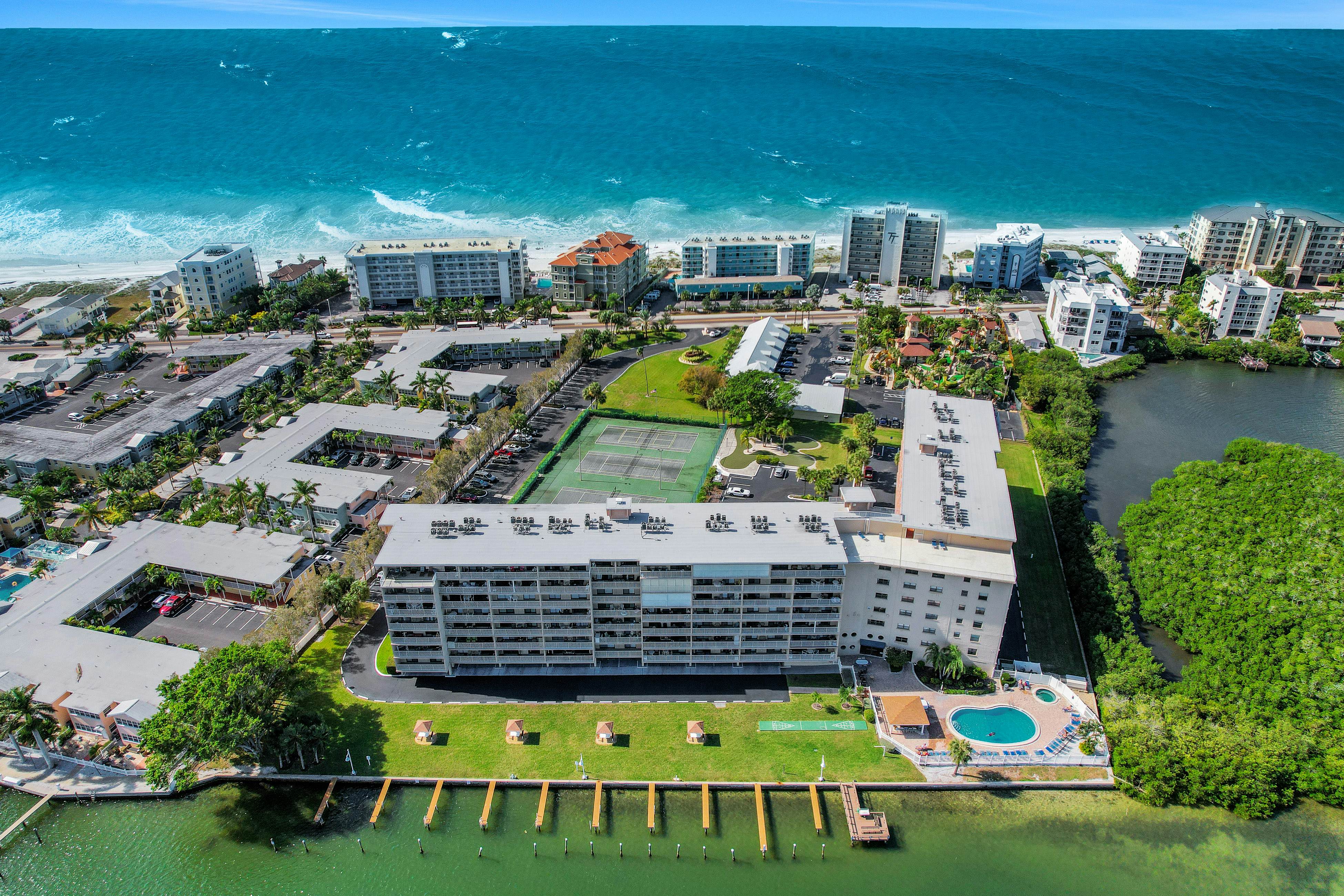 Elegant condo with water view near beach - pool & hot tub, fast WiFi & AC