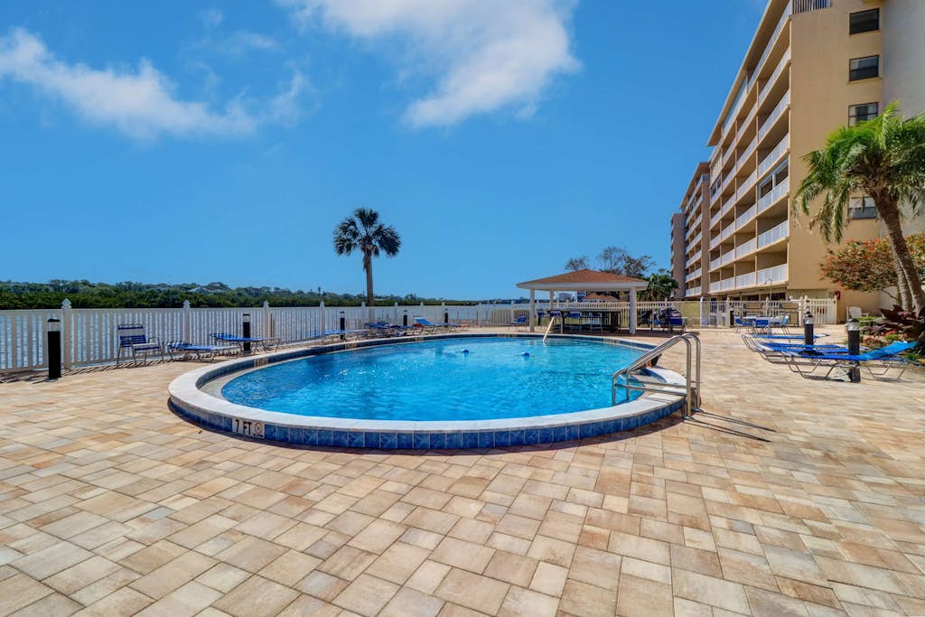 Elegant condo with water view near beach pool and hot tub fast WiFi and AC