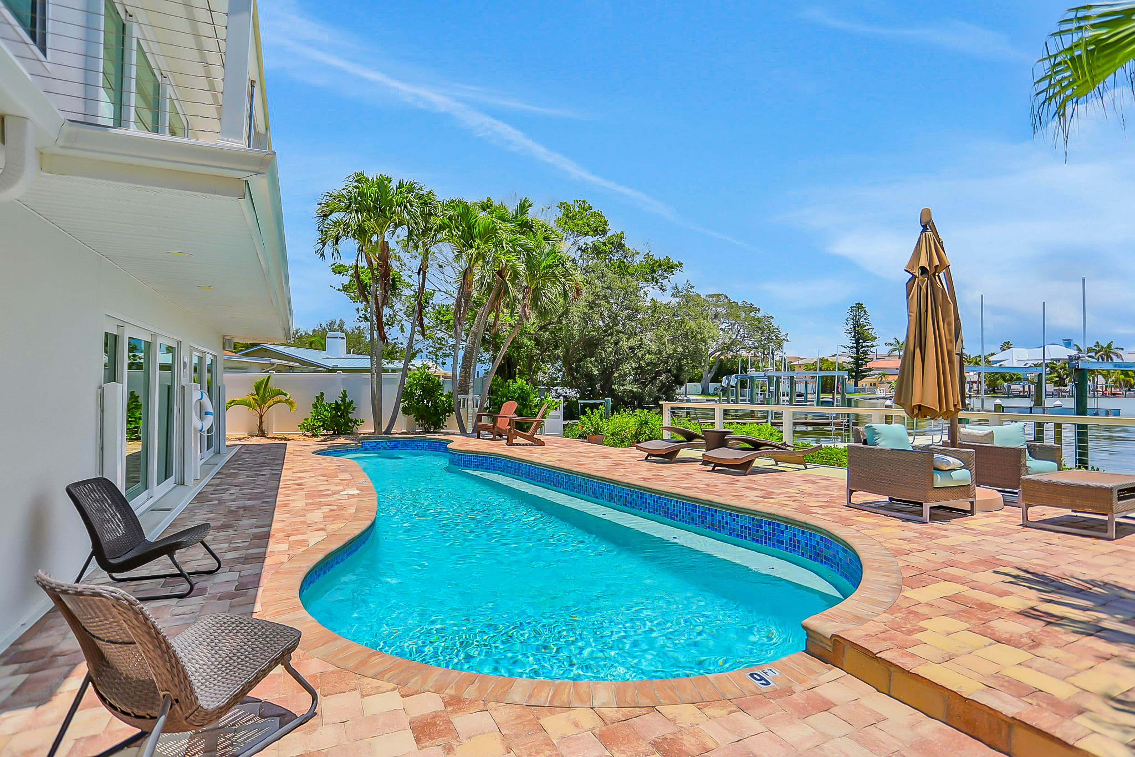 Stylish waterfront home with private pool, dock 