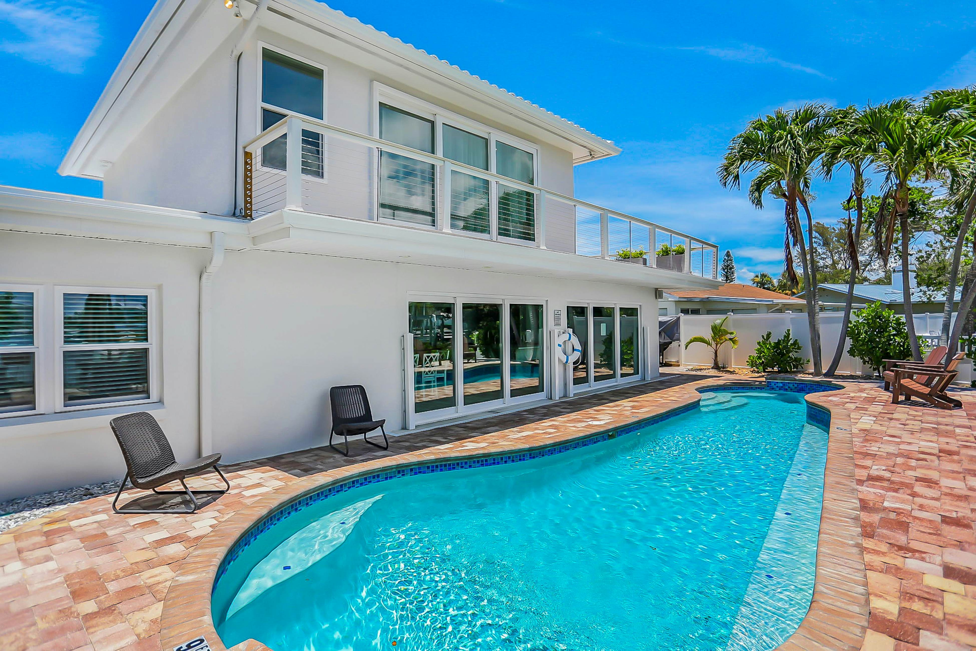 Stylish waterfront home with private pool, dock 