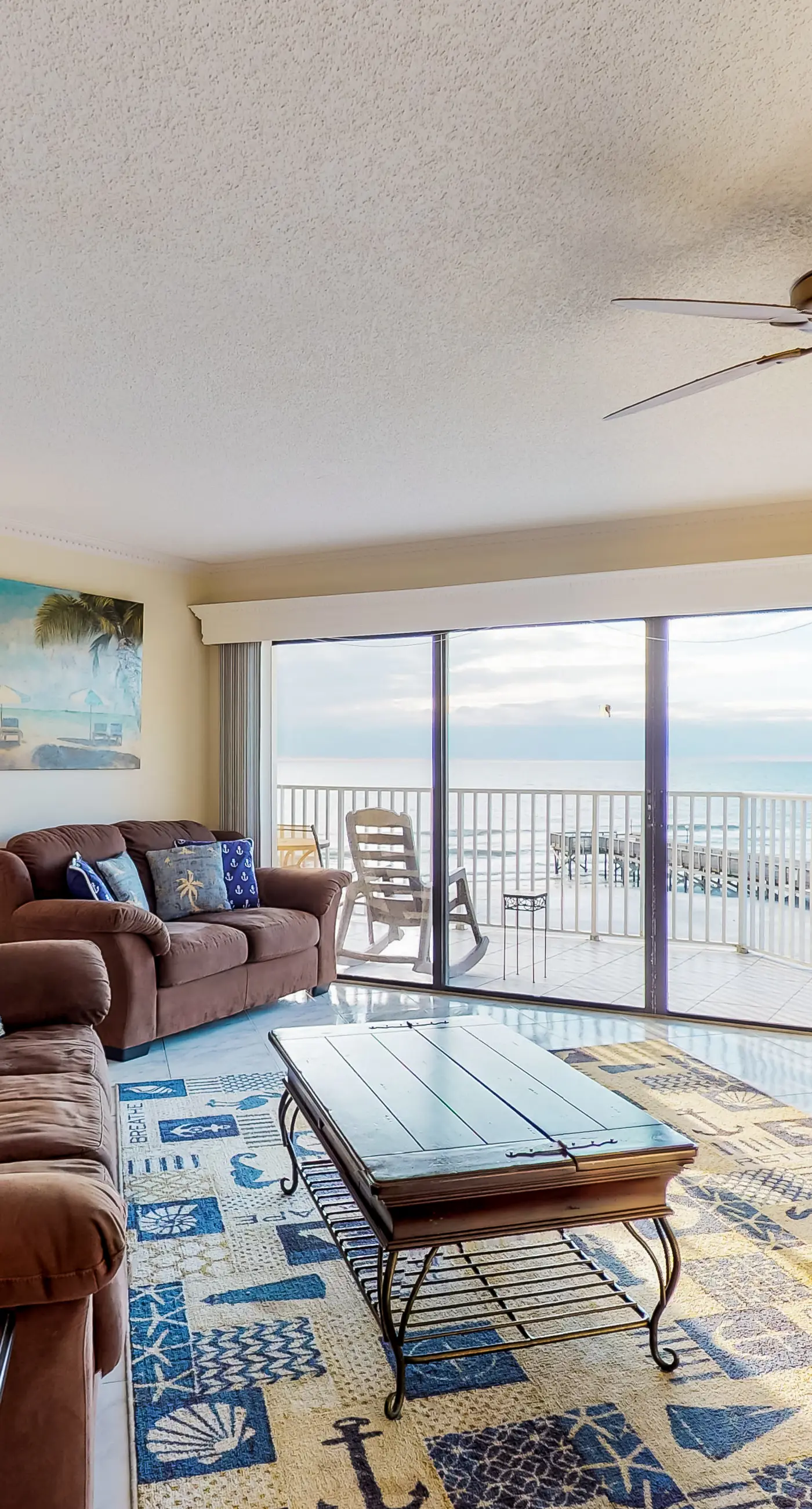 Sunny beachfront condo with pool access to beach attractions