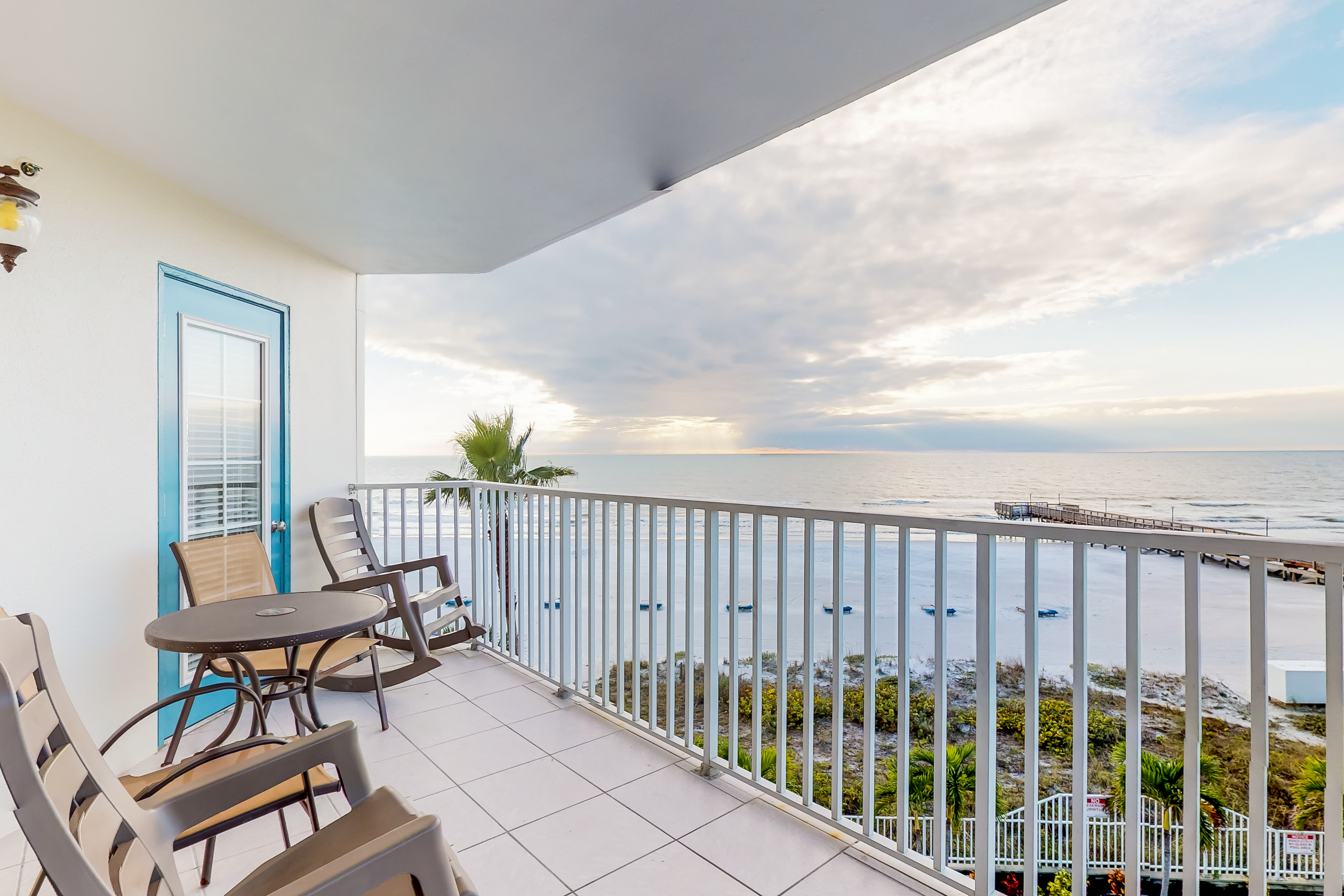 Sunny beachfront condo with pool access to beach attractions