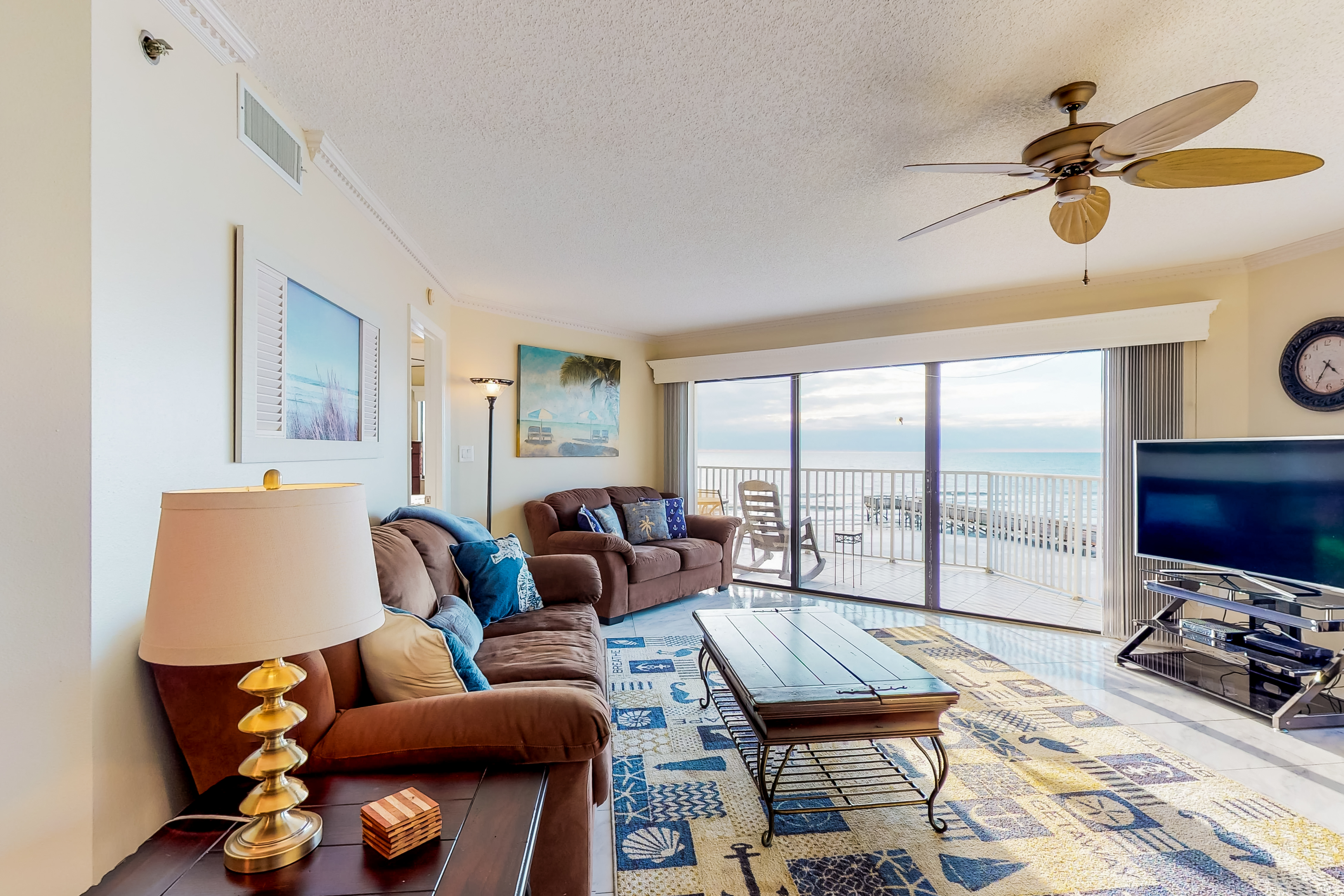 Sunny beachfront condo with pool access to beach attractions