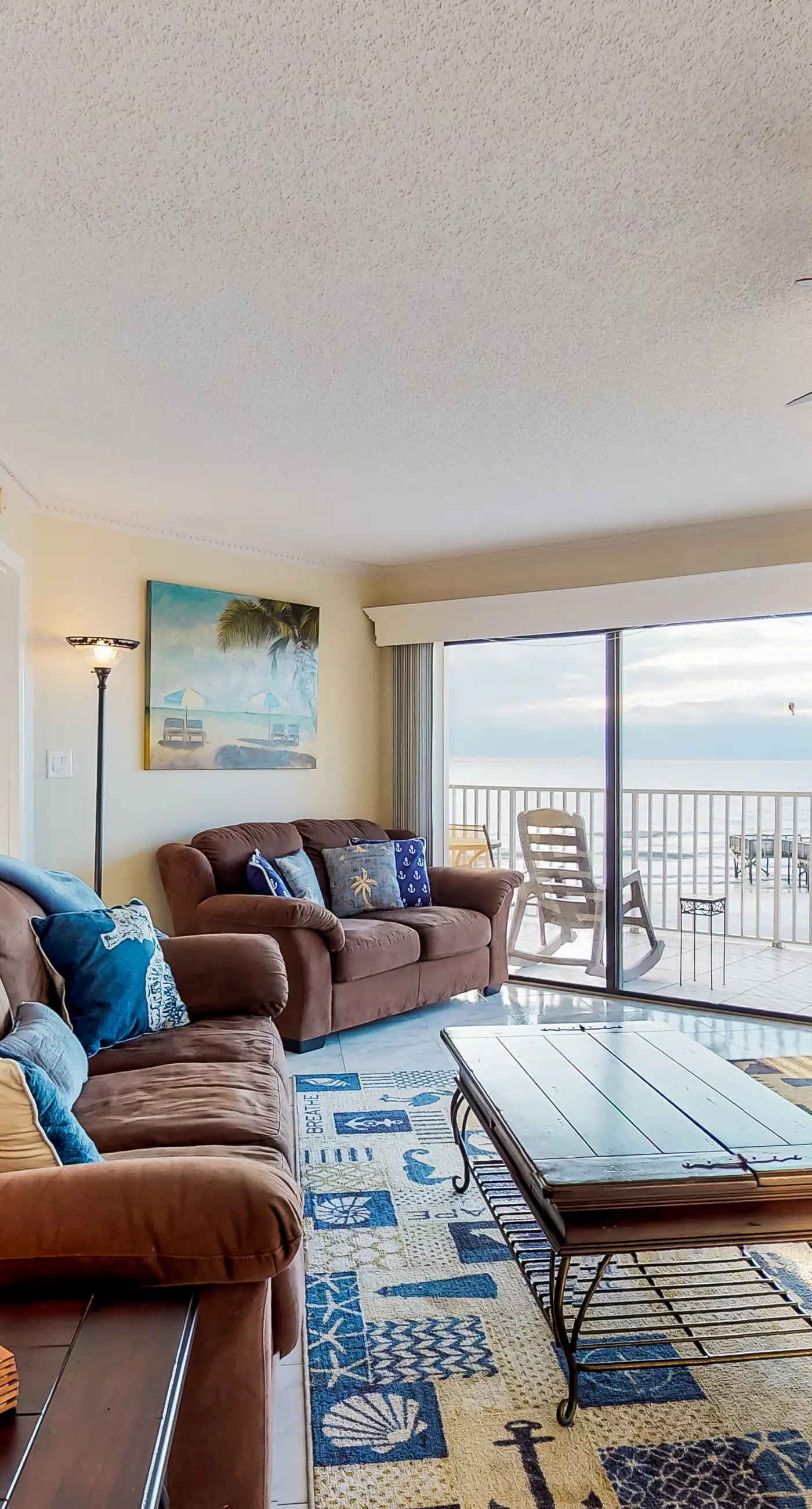 Sunny beachfront condo with pool access to beach attractions