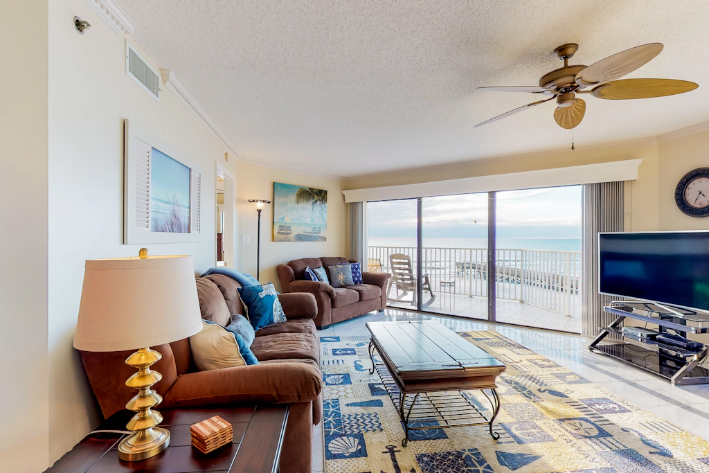Sunny beachfront condo with pool access to beach attractions