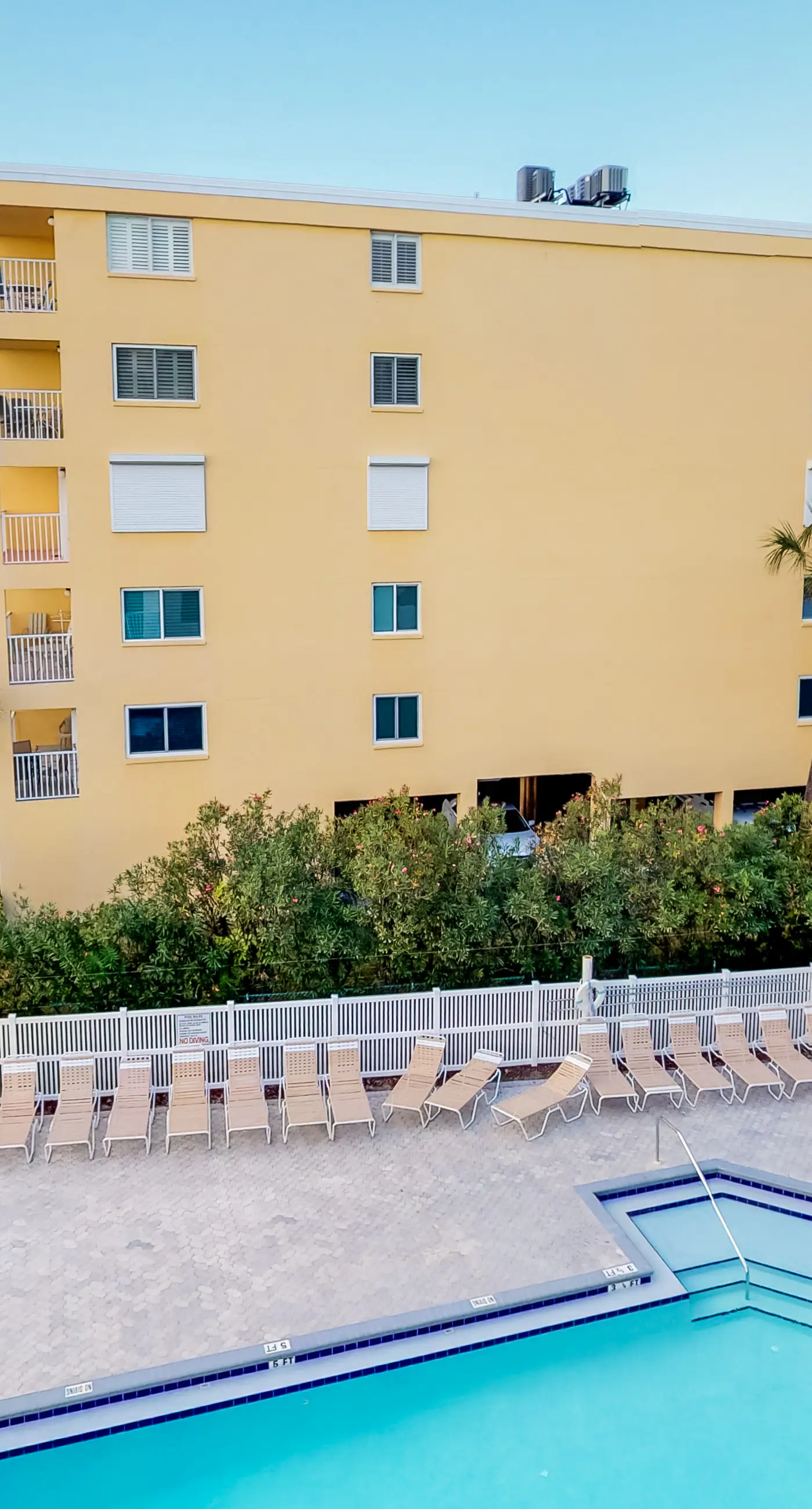 Sunny beachfront condo with pool access to beach attractions