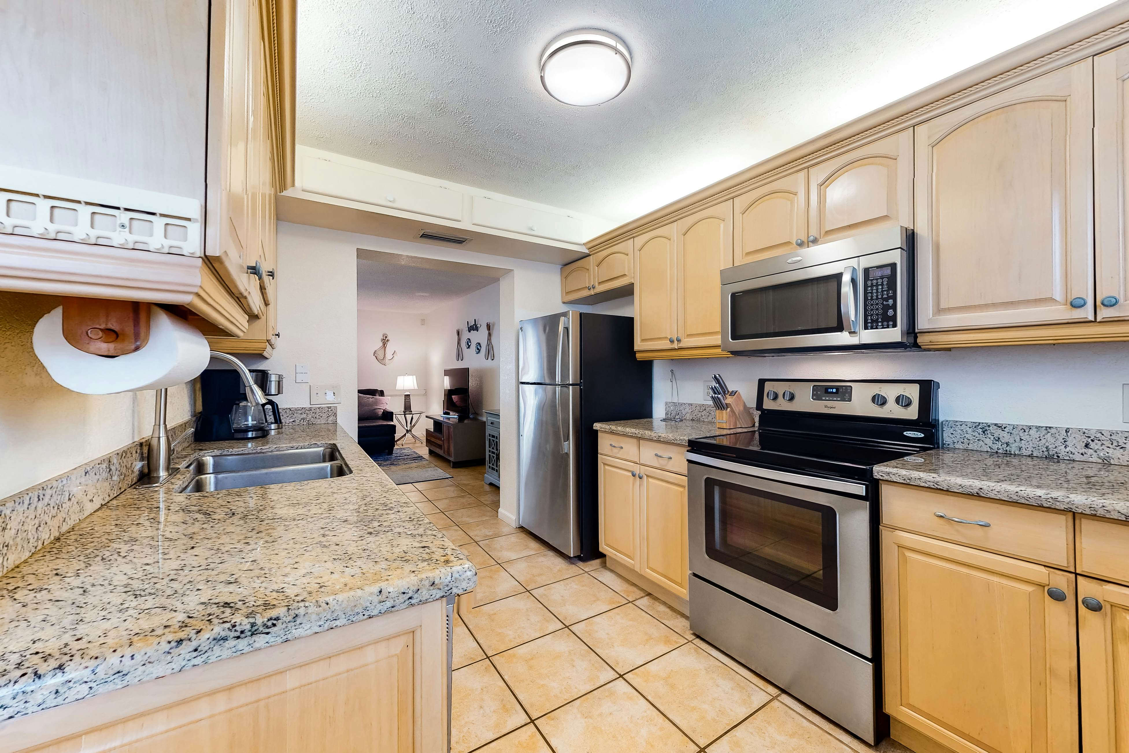 Quiet condo across from beach with Intracoastal-view pool, grill & fishing dock