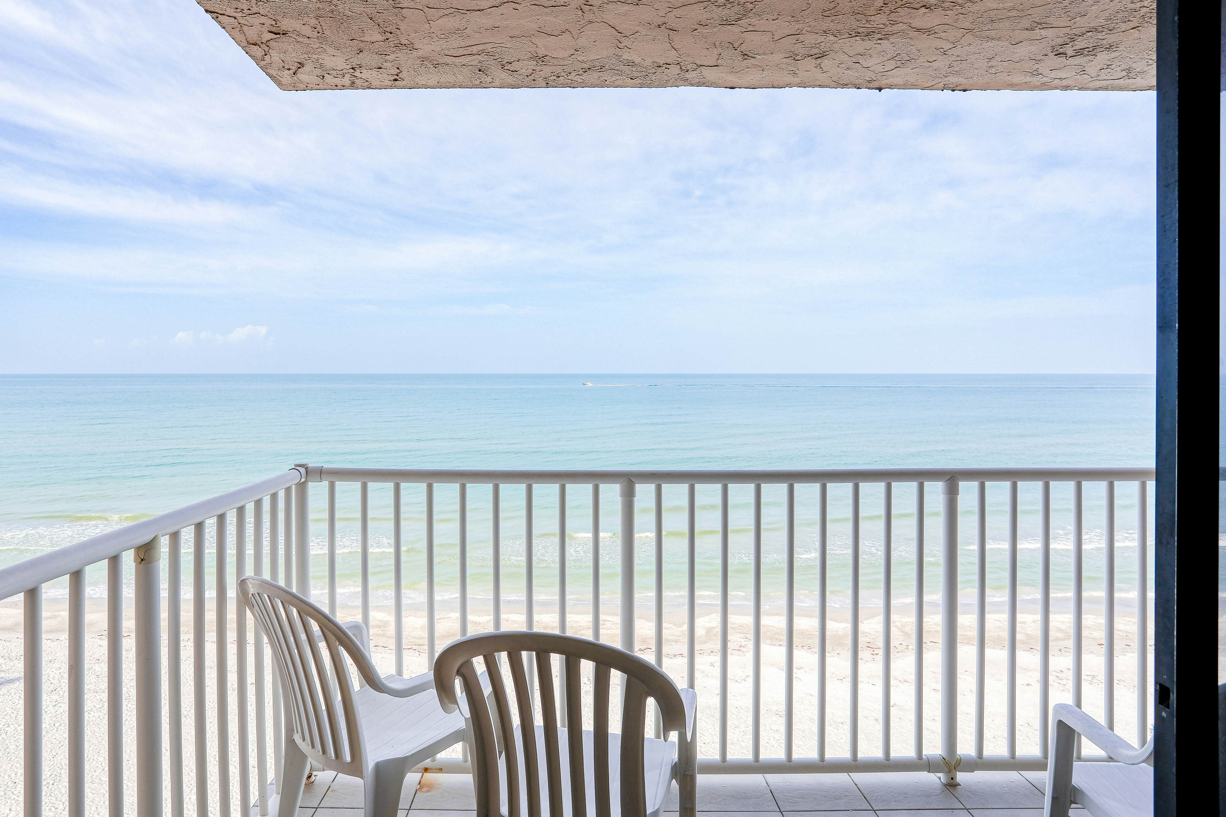 Delightful waterfront condo with sweeping views, beach access, balcony & pool