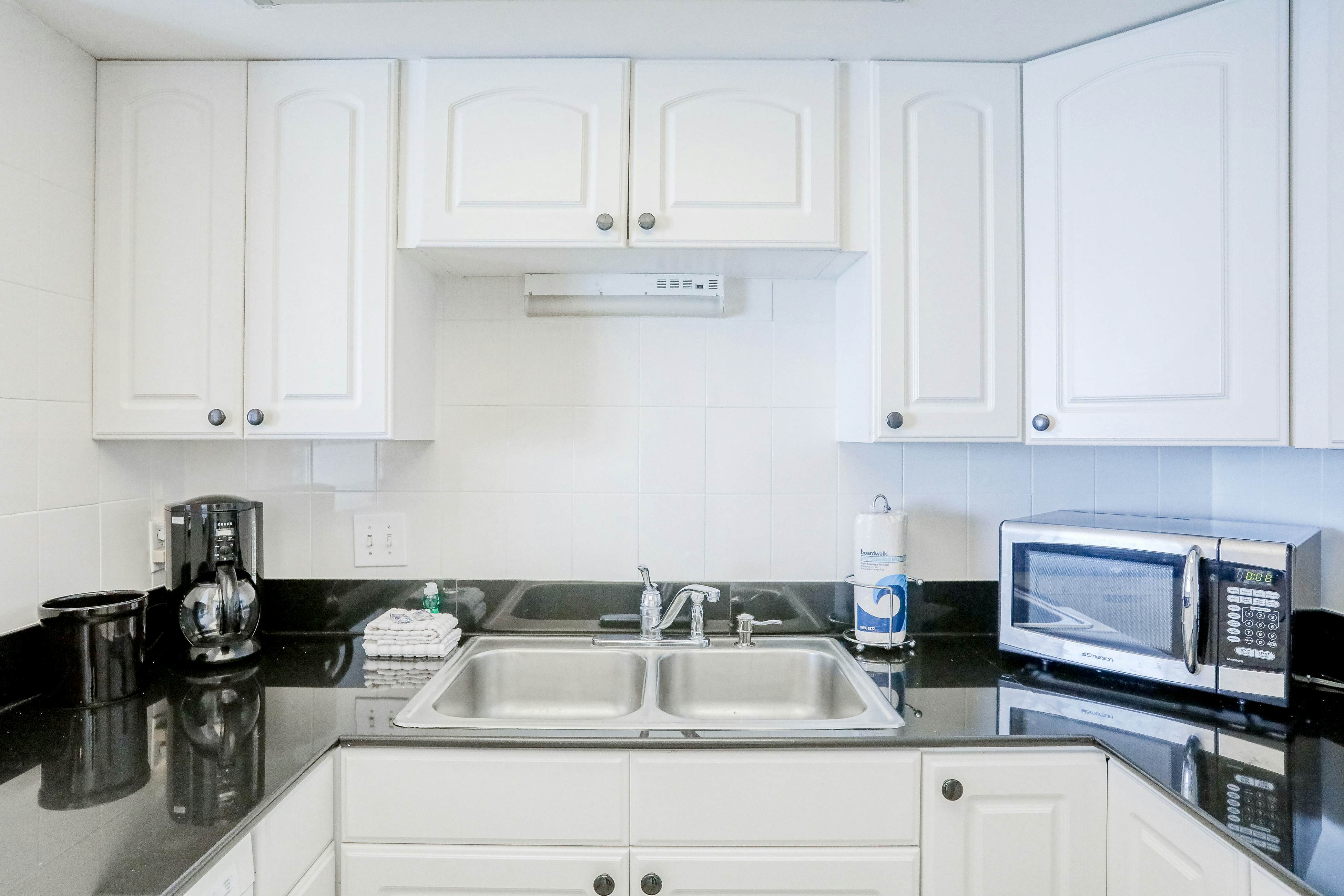 Delightful waterfront condo with sweeping views, beach access, balcony & pool