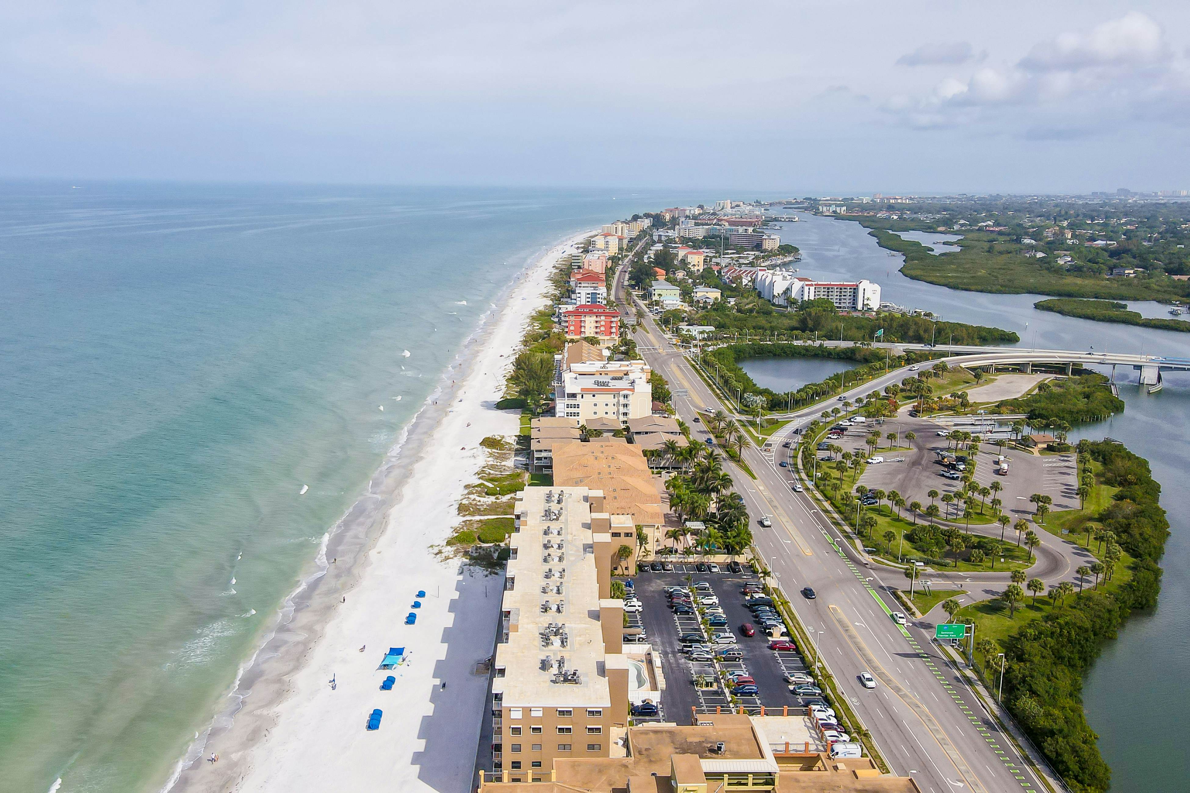 Delightful waterfront condo with sweeping views, beach access, balcony & pool