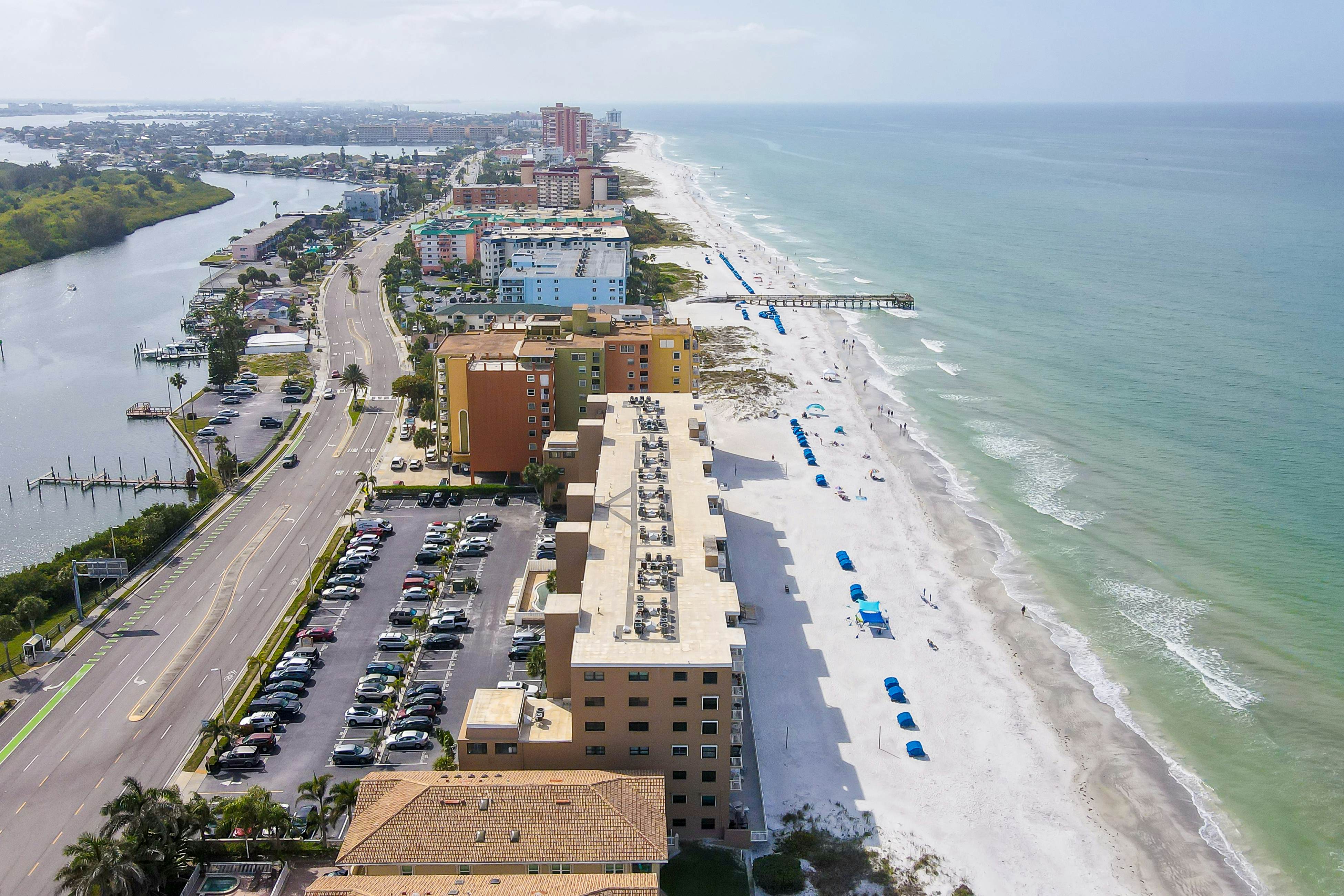 Delightful waterfront condo with sweeping views, beach access, balcony & pool