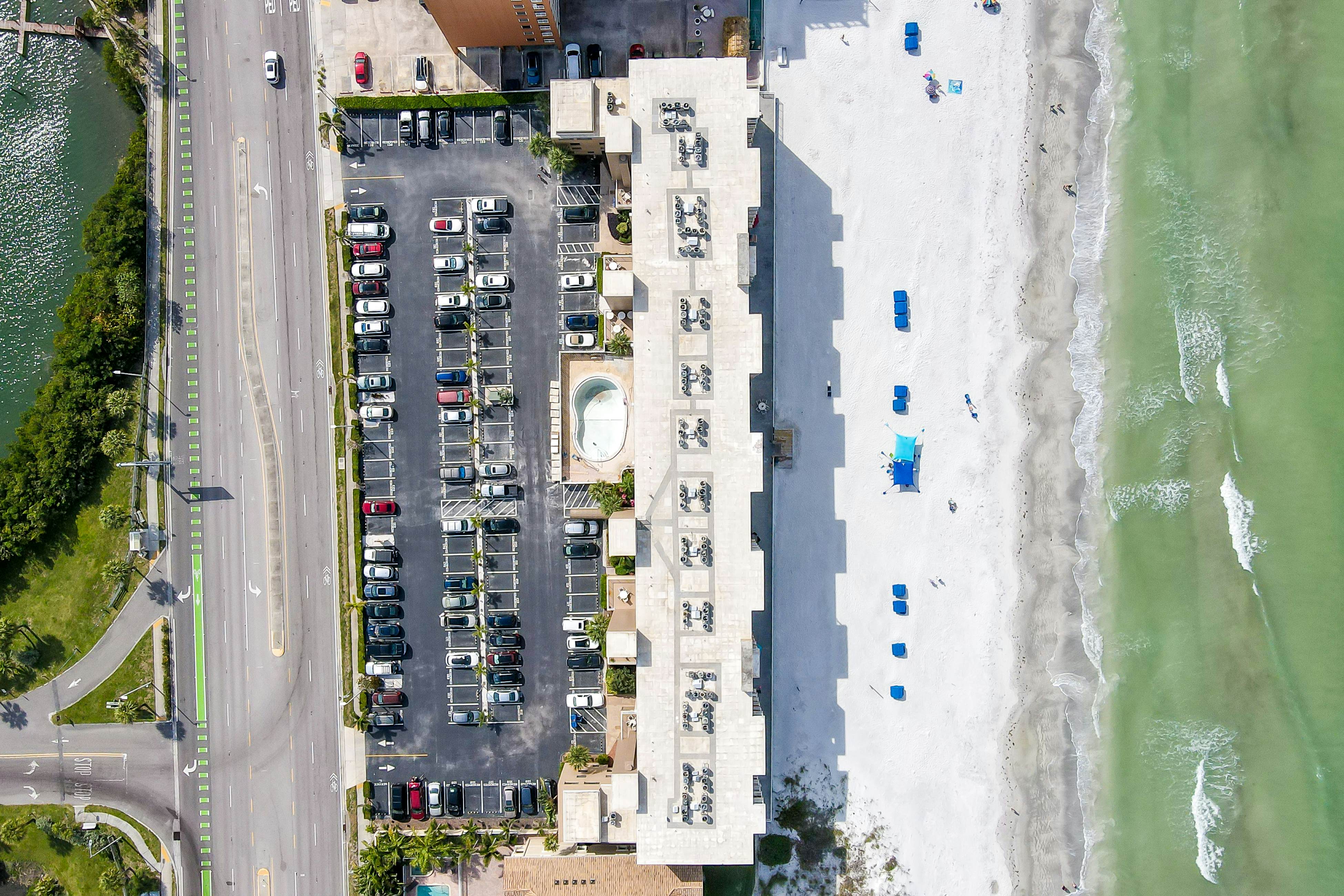 Delightful waterfront condo with sweeping views, beach access, balcony & pool