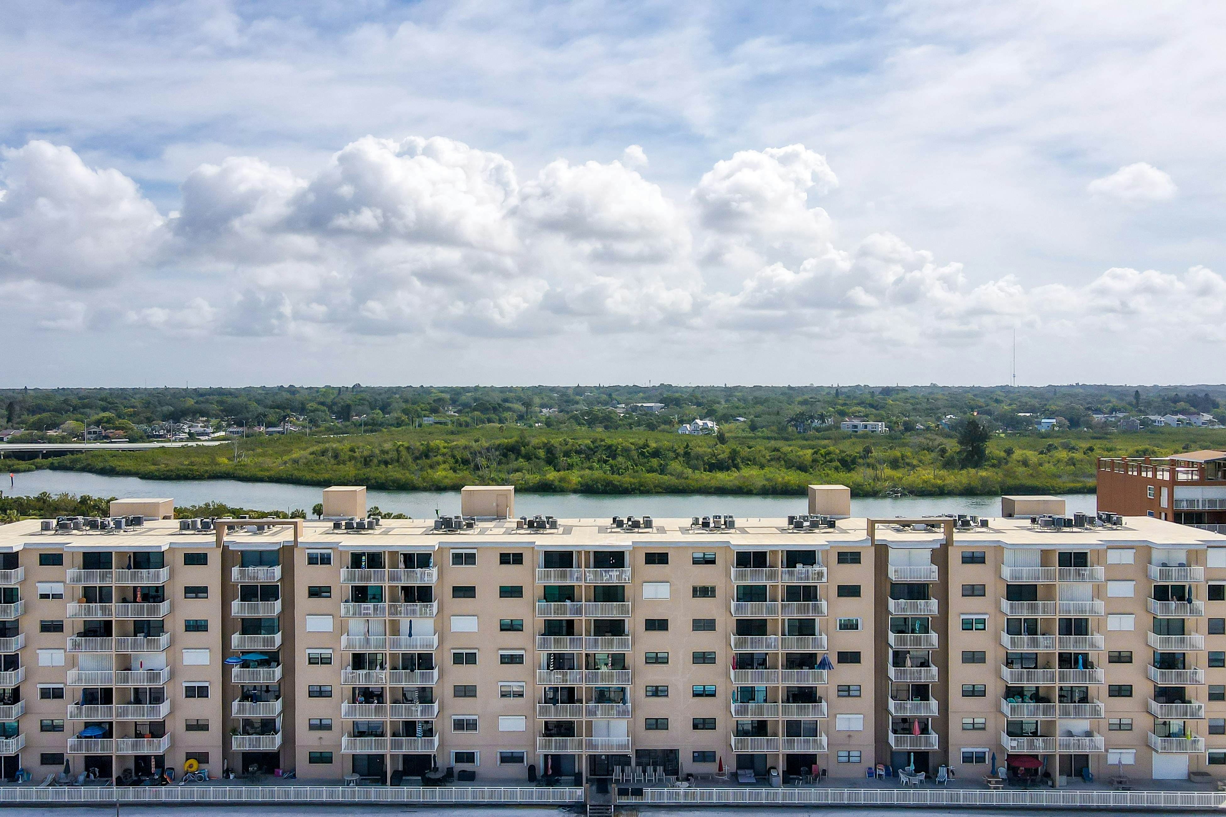 Delightful waterfront condo with sweeping views, beach access, balcony & pool