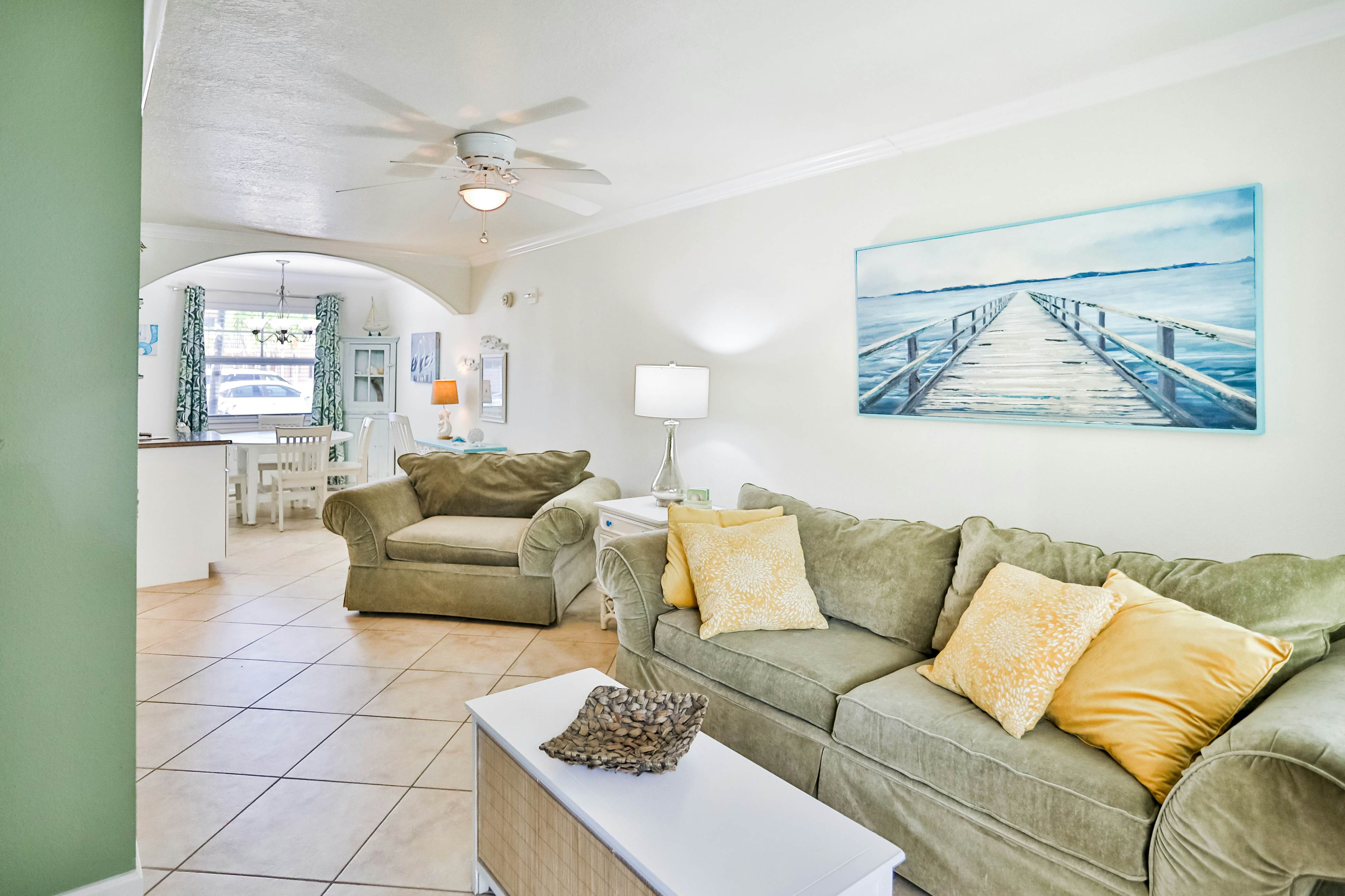 1st-floor condo with private dock, easy beach access, heated pool, & patio