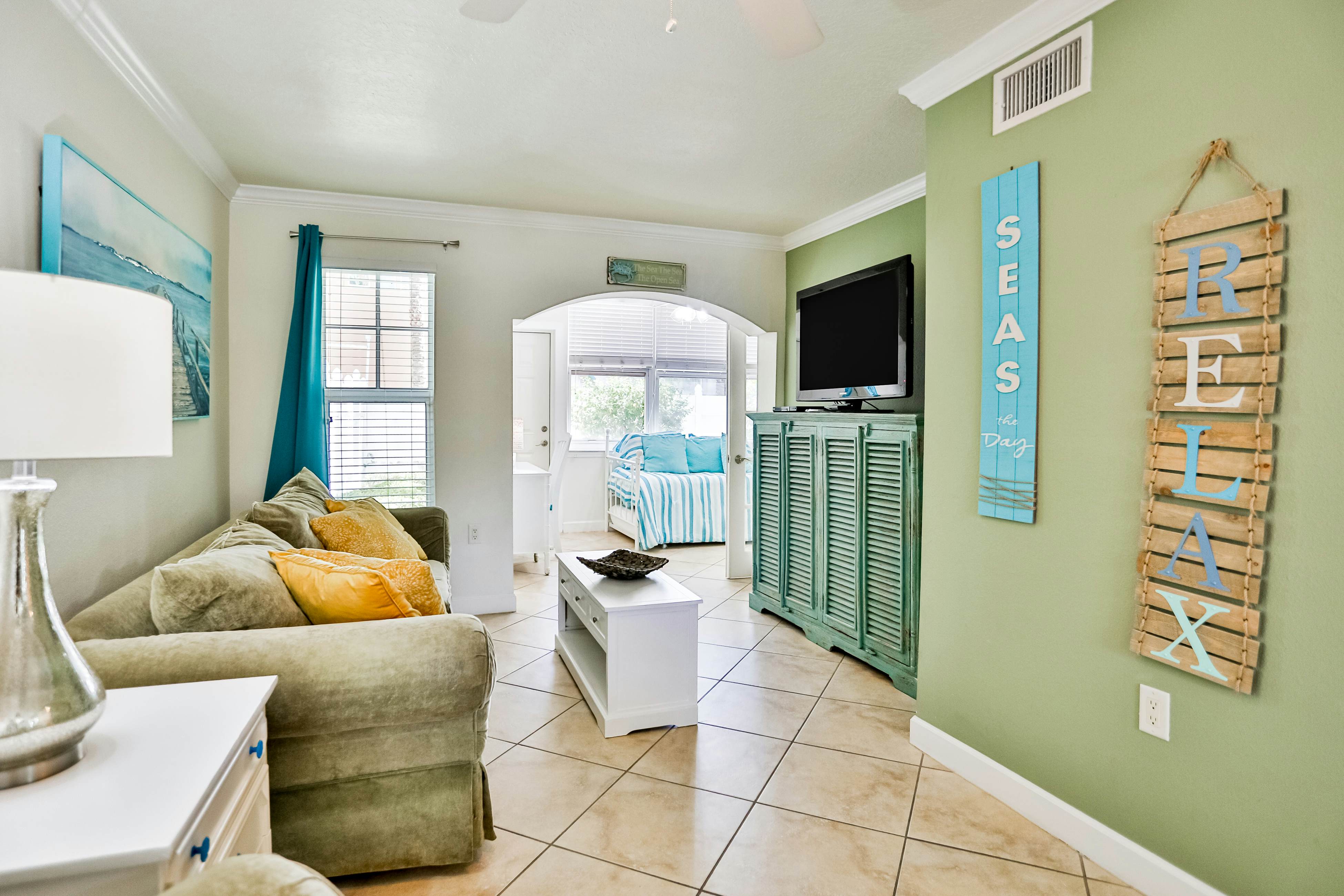 1st-floor condo with private dock, easy beach access, heated pool, & patio