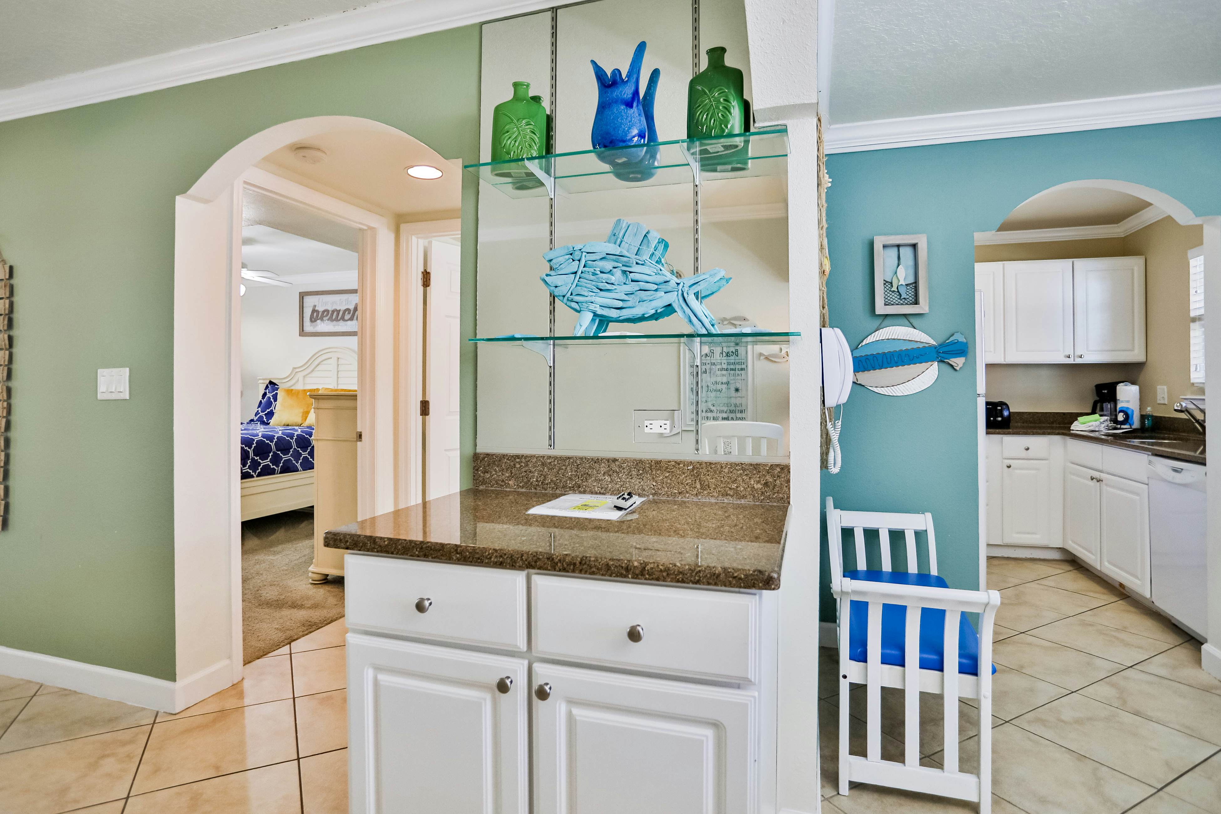 1st-floor condo with private dock, easy beach access, heated pool, & patio