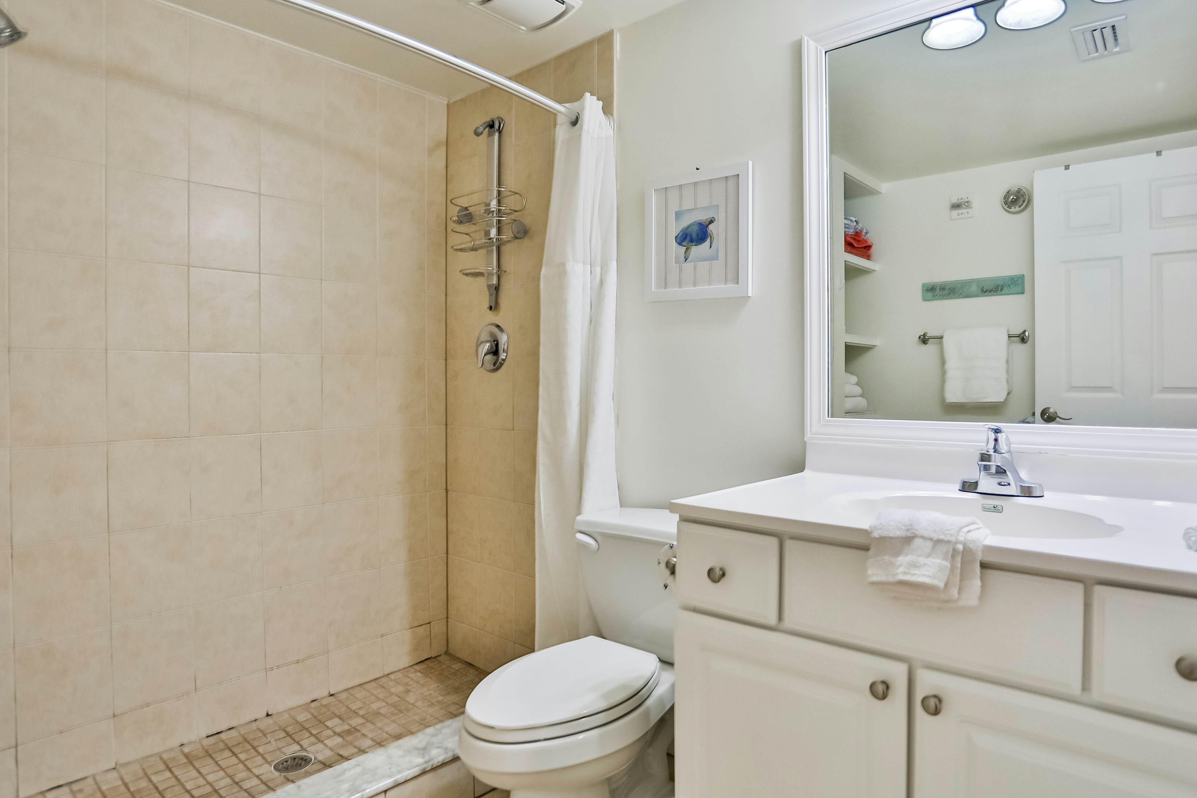 1st-floor condo with private dock, easy beach access, heated pool, & patio