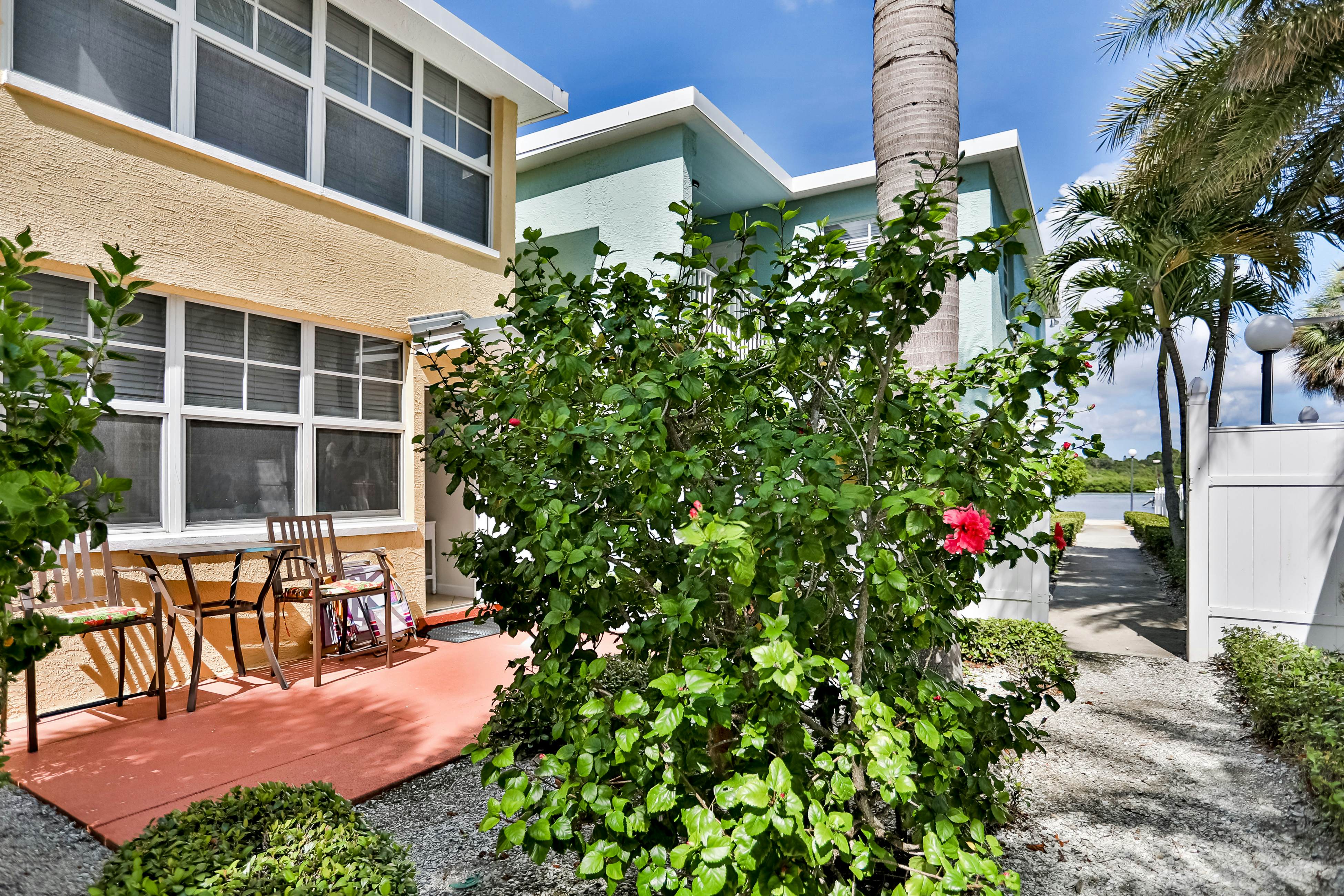 1st-floor condo with private dock, easy beach access, heated pool, & patio