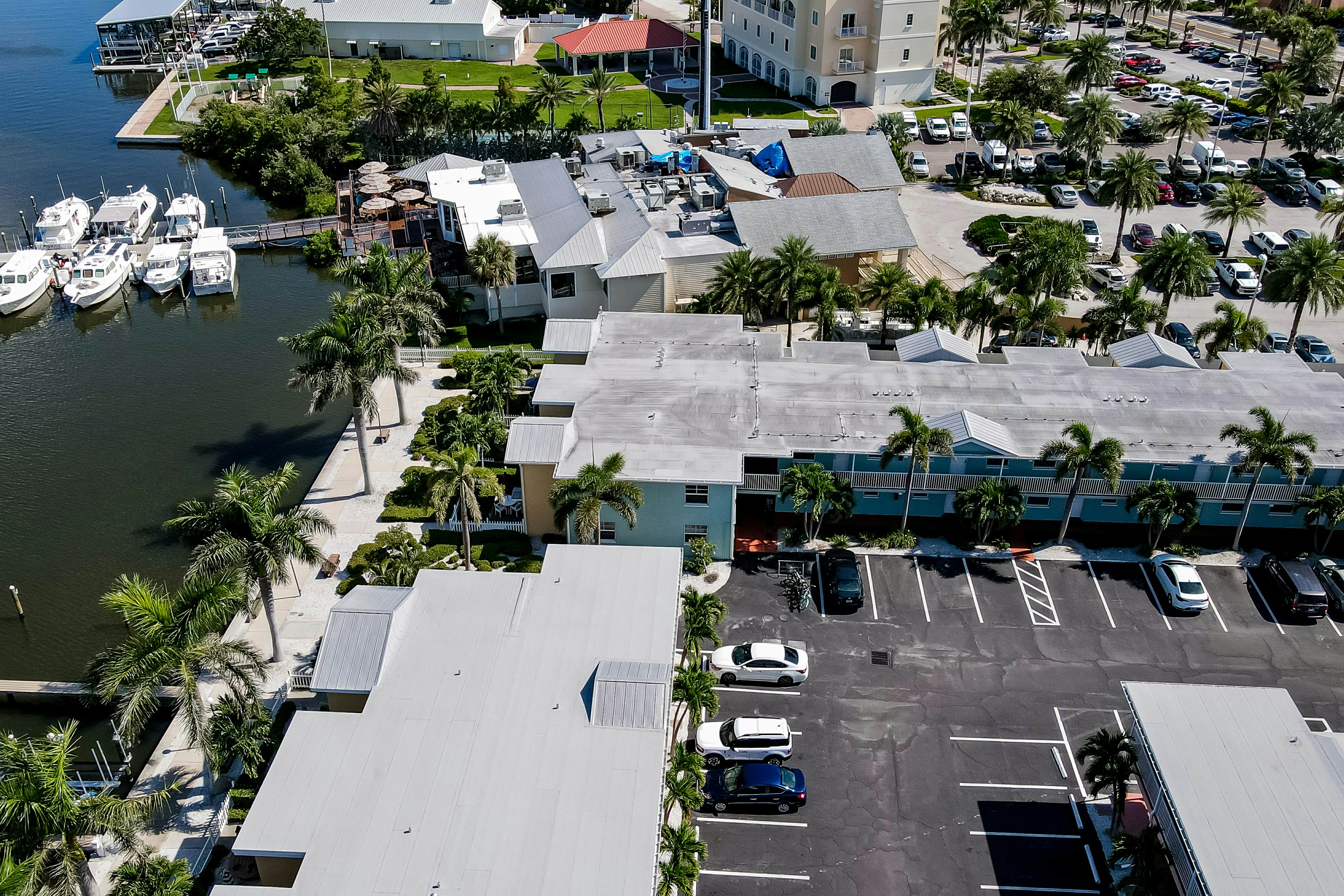 1st-floor condo with private dock, easy beach access, heated pool, & patio