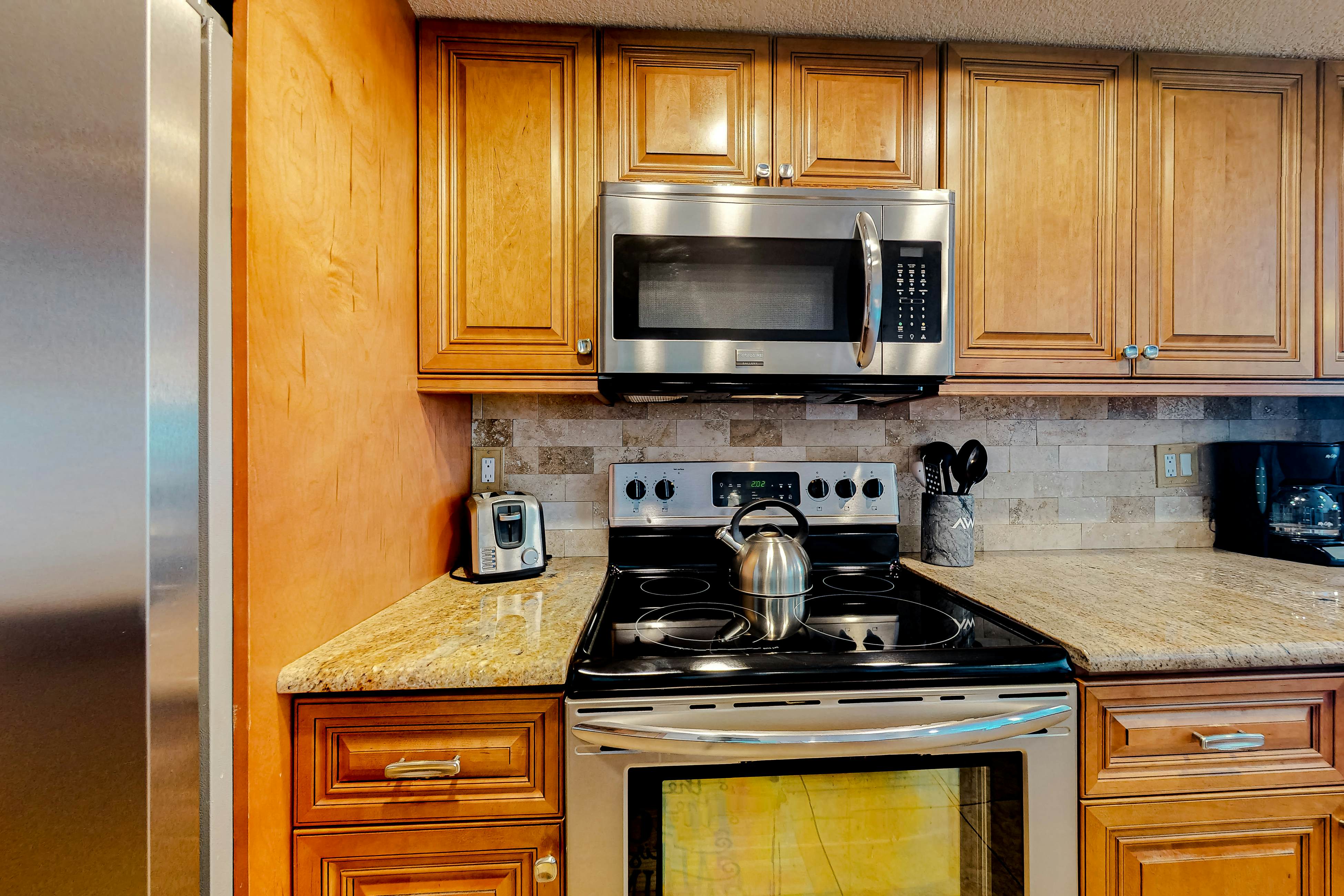 Waterfront condo with heated pool, hot tub, central AC & W/D - snowbird-friendly