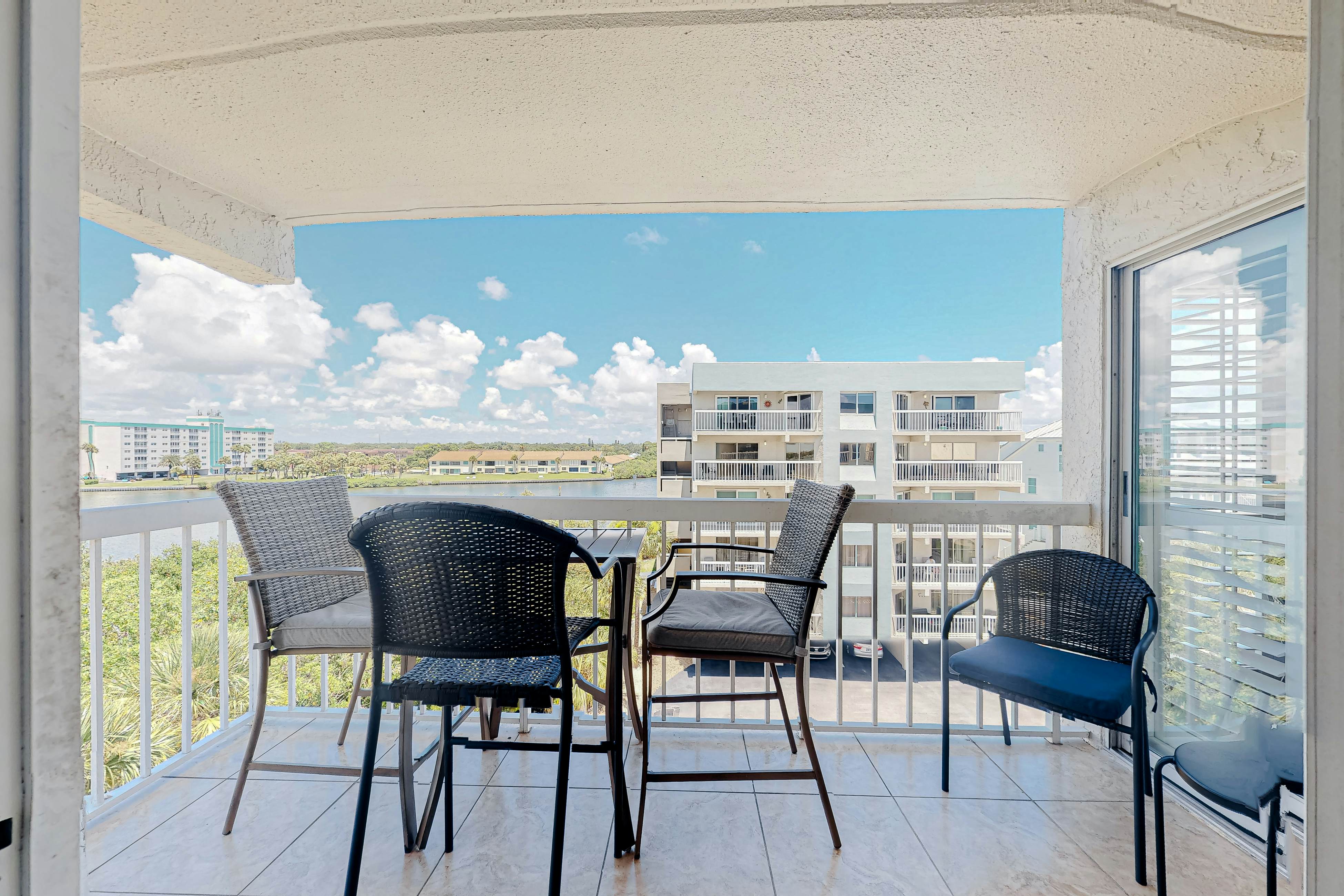 Waterfront condo with heated pool, hot tub, central AC & W/D - snowbird-friendly