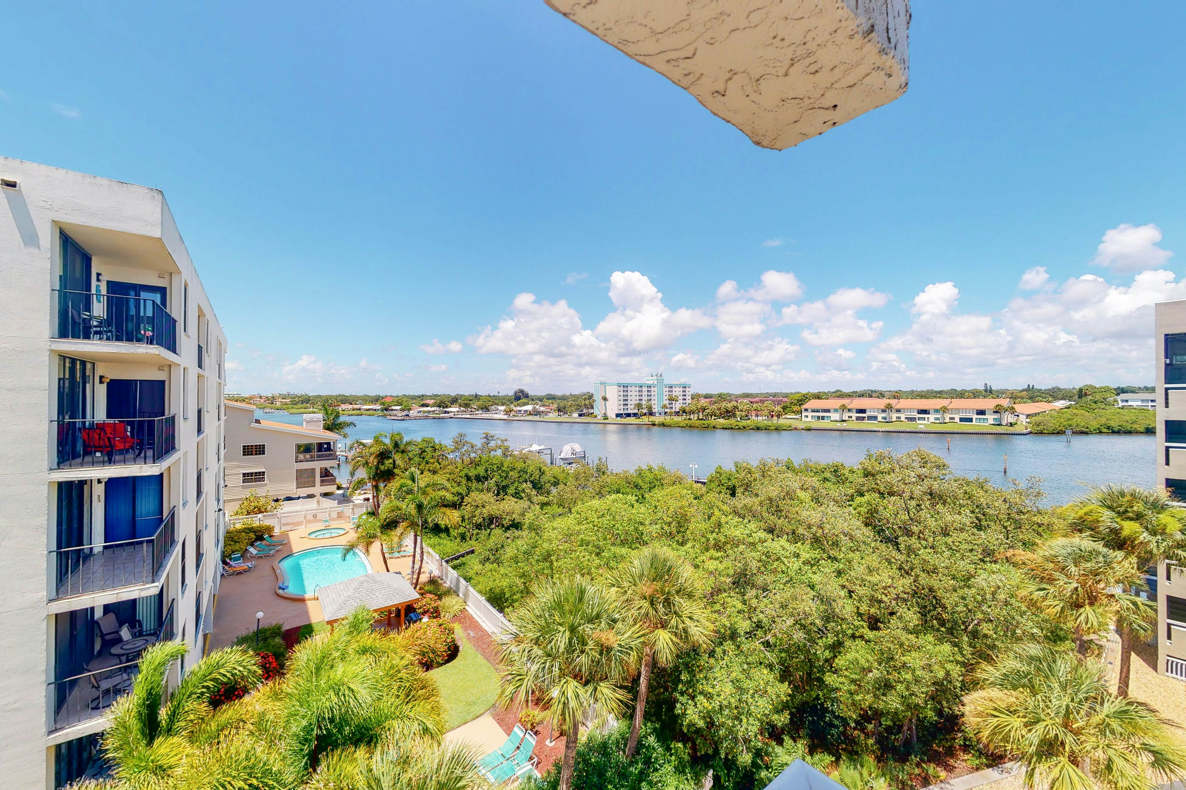 Waterfront condo with heated pool, hot tub, central AC & W/D - snowbird-friendly