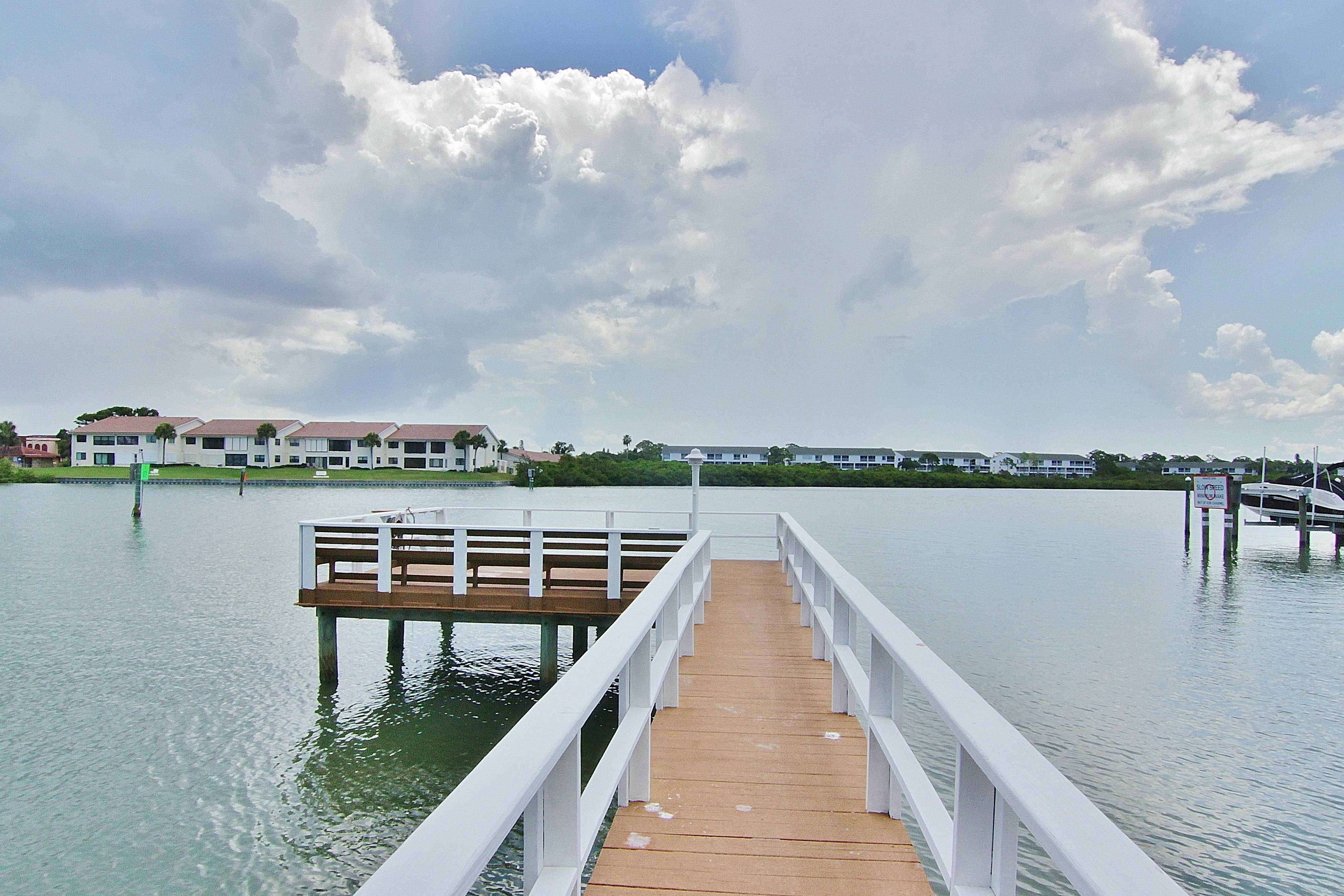 Waterfront condo with heated pool, hot tub, central AC & W/D - snowbird-friendly