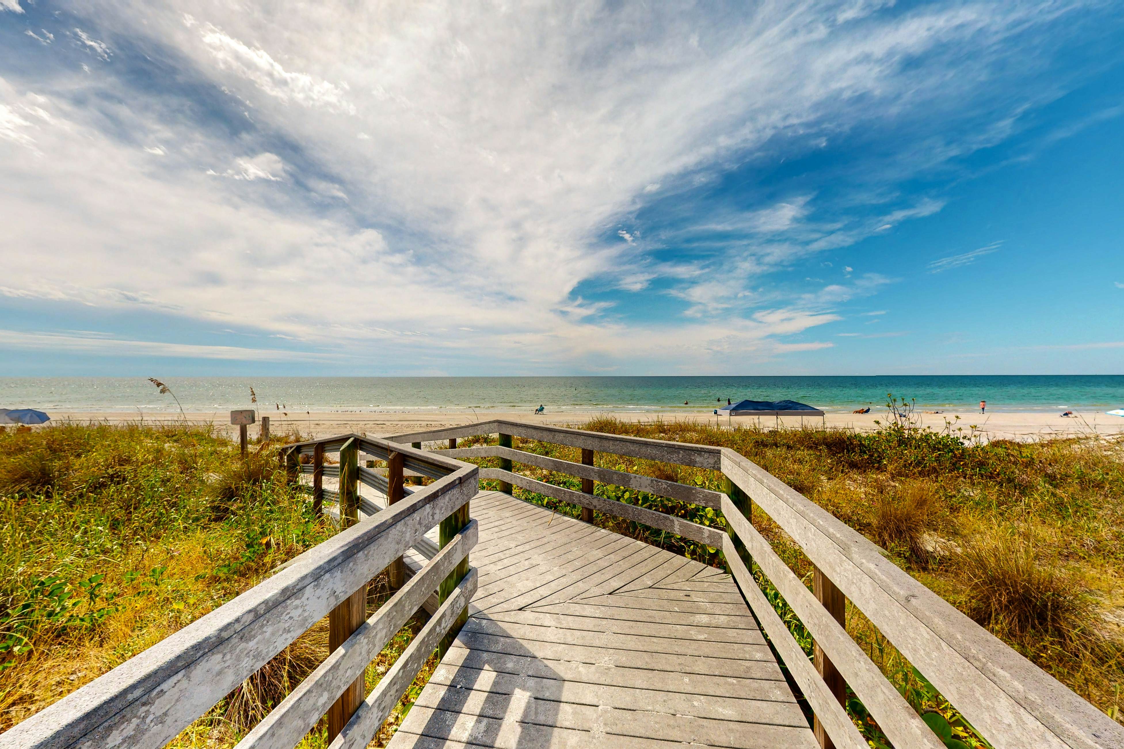 Dog-friendly beachfront condo with pool, hot tub, tennis & AC -snowbird-friendly