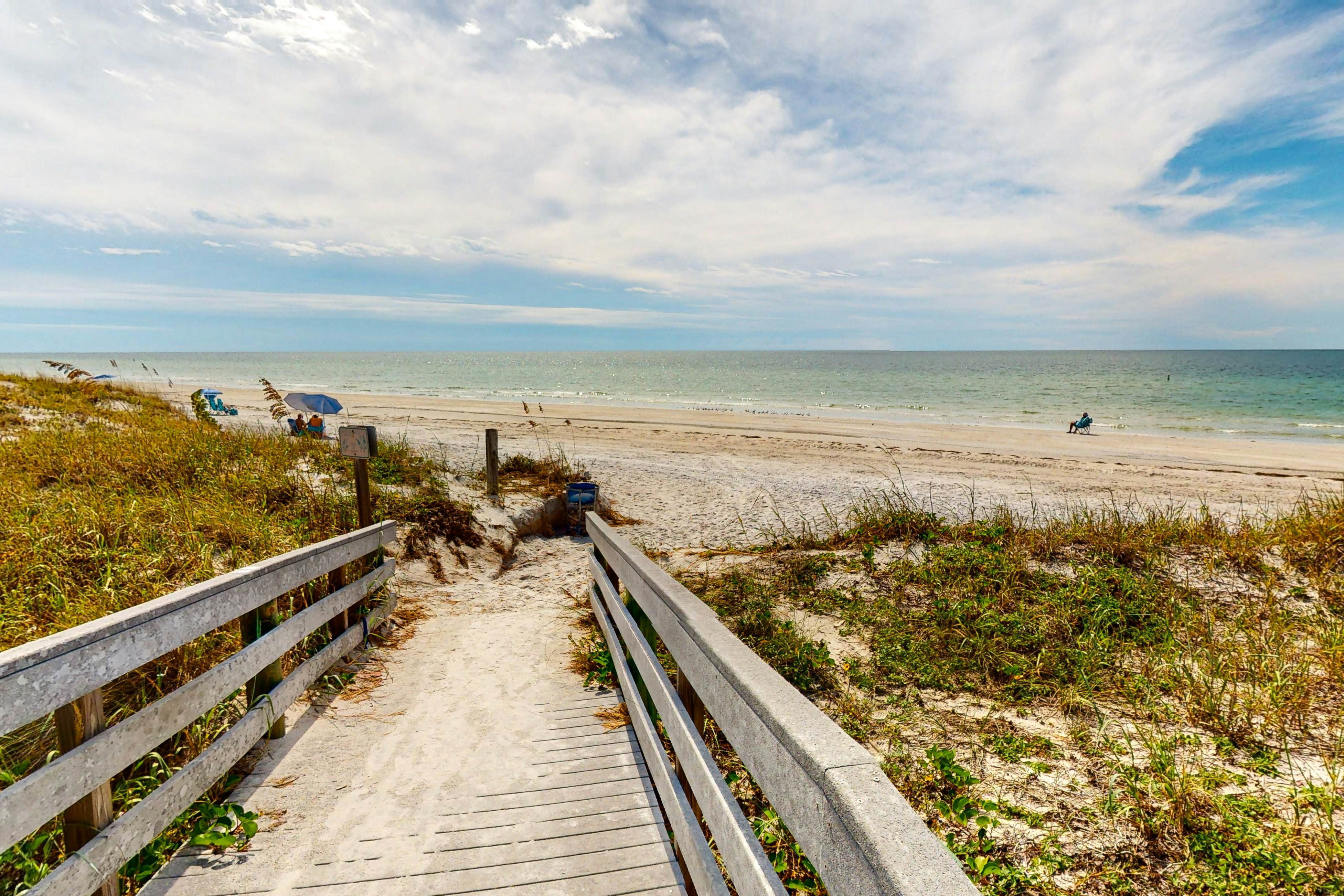 Dog-friendly beachfront condo with pool, hot tub, tennis & AC -snowbird-friendly