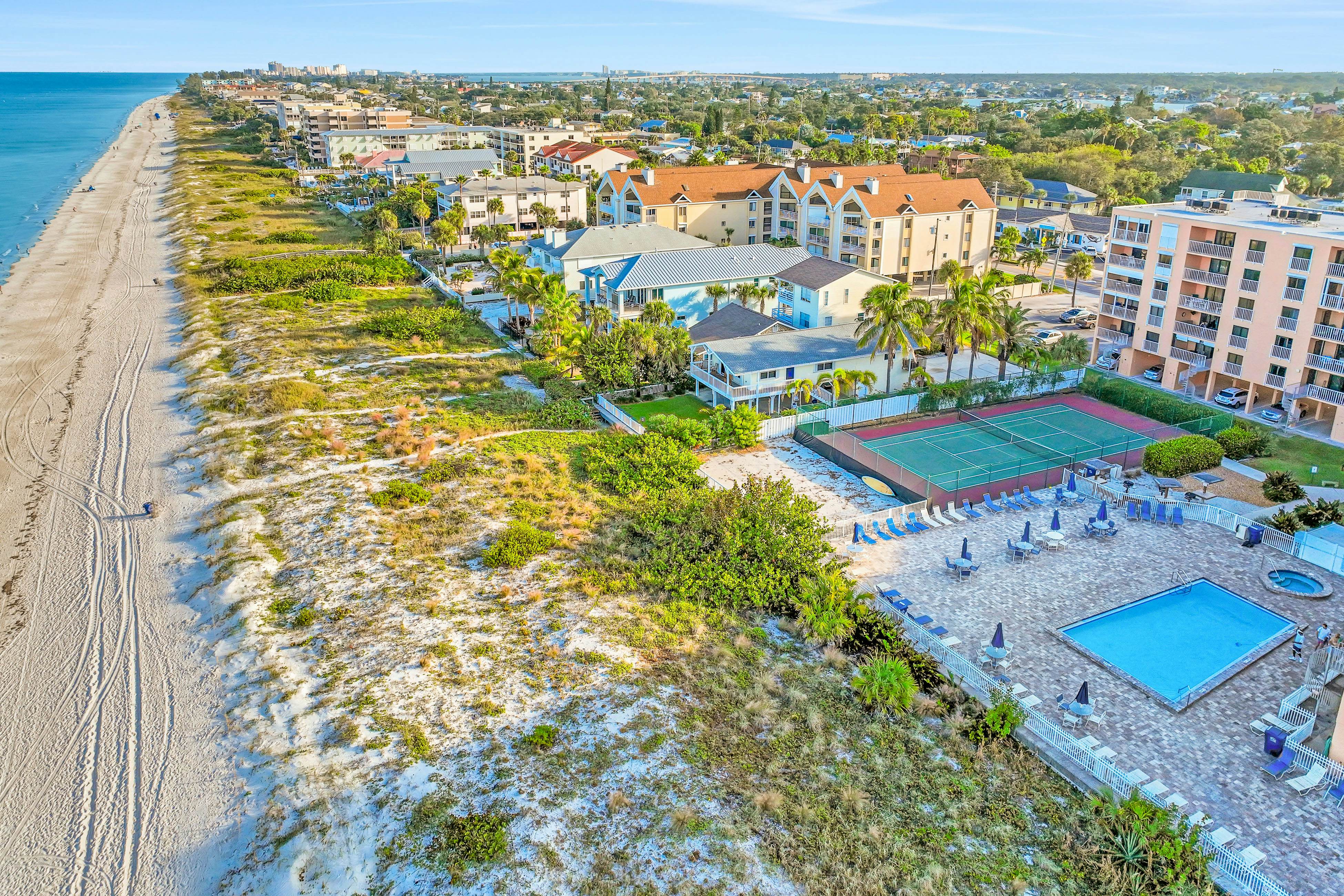 Dog-friendly beachfront condo with pool, hot tub, tennis & AC -snowbird-friendly