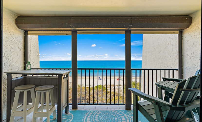 Gorgeous updated and spacious condo with stunning beachfront view pool WD and AC