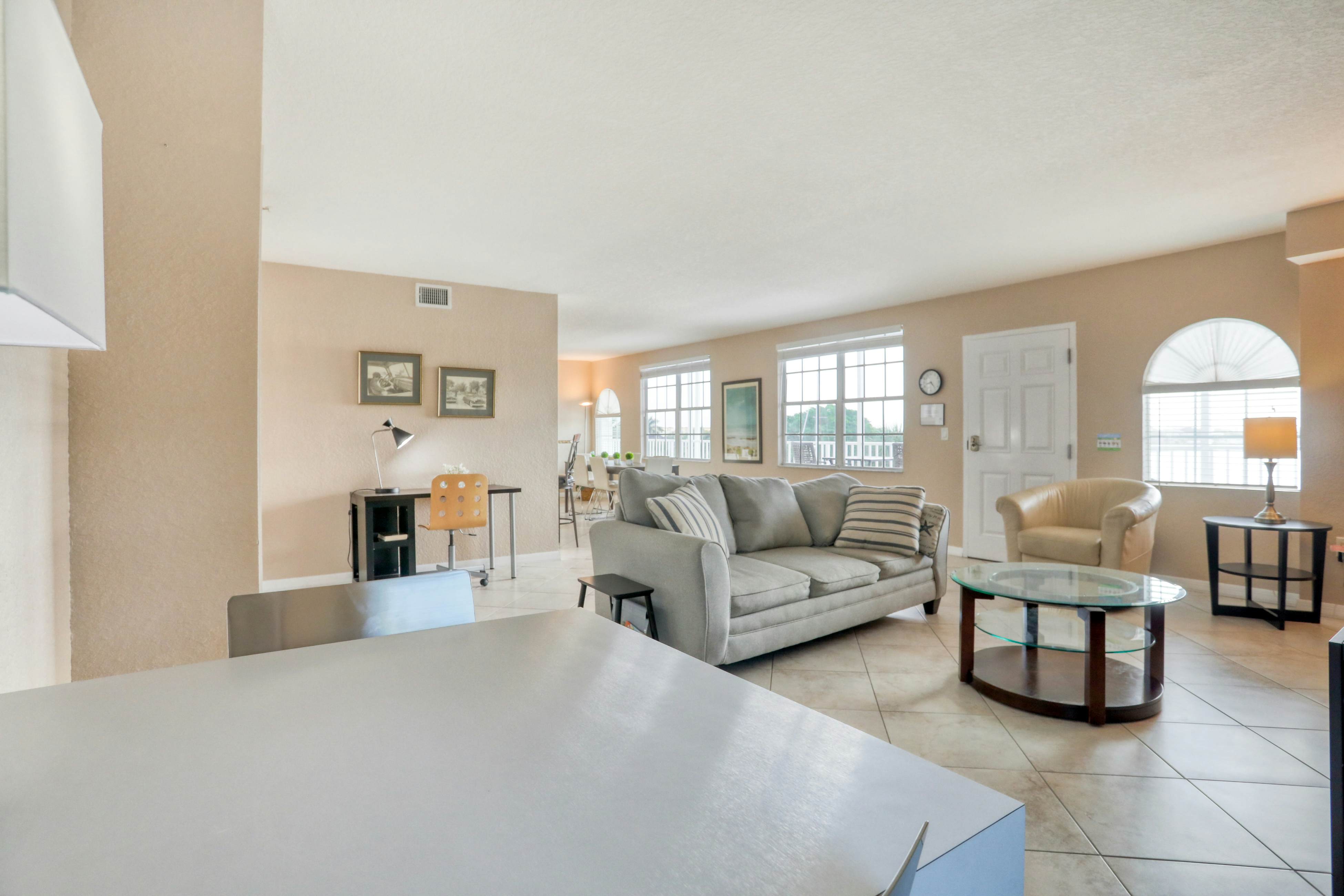 Third-floor condo with pool access, fast WiFi, central AC, & W/D - snowbirds OK