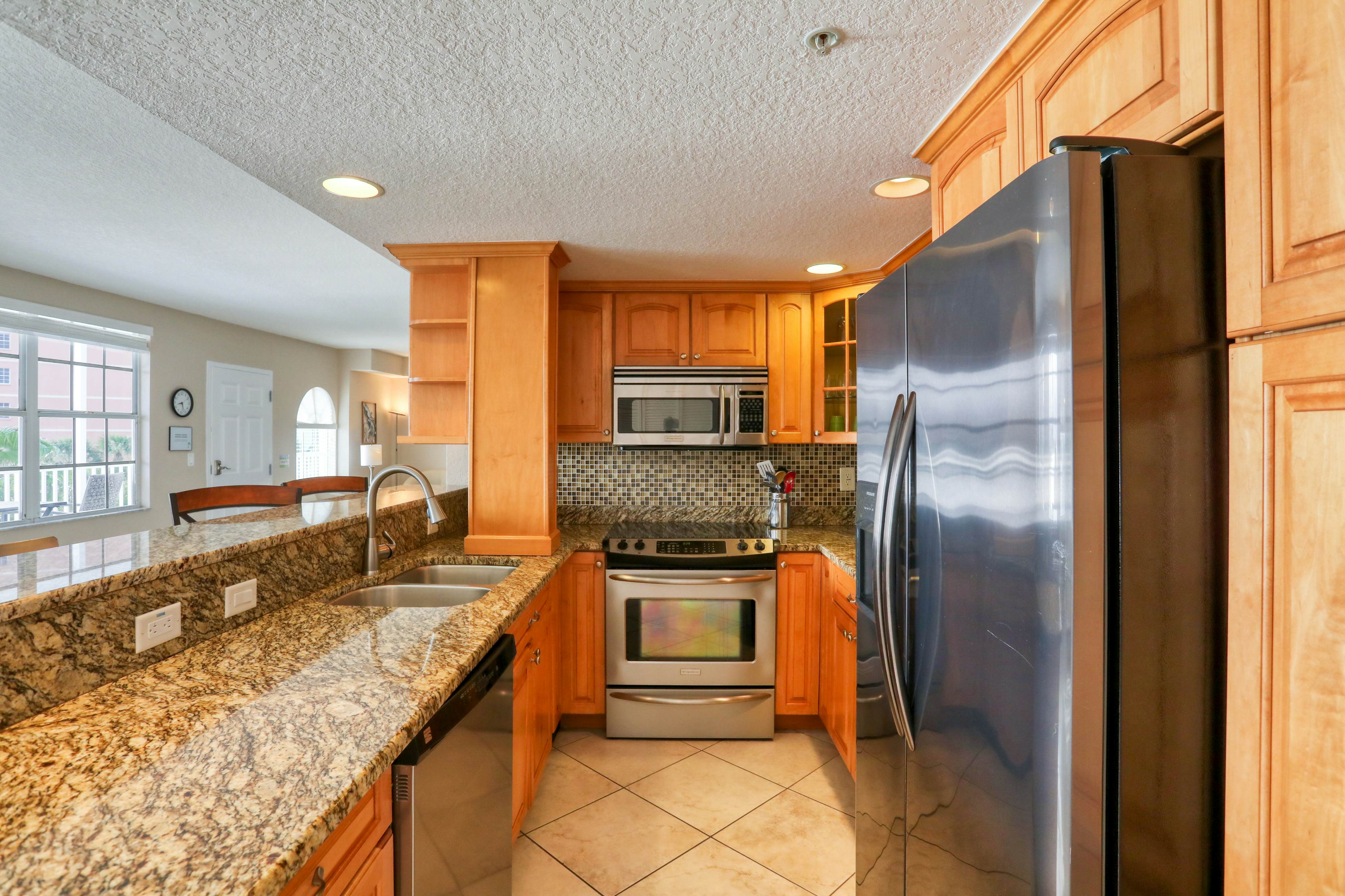 Third-floor condo with pool access, fast WiFi, central AC, & W/D - snowbirds OK