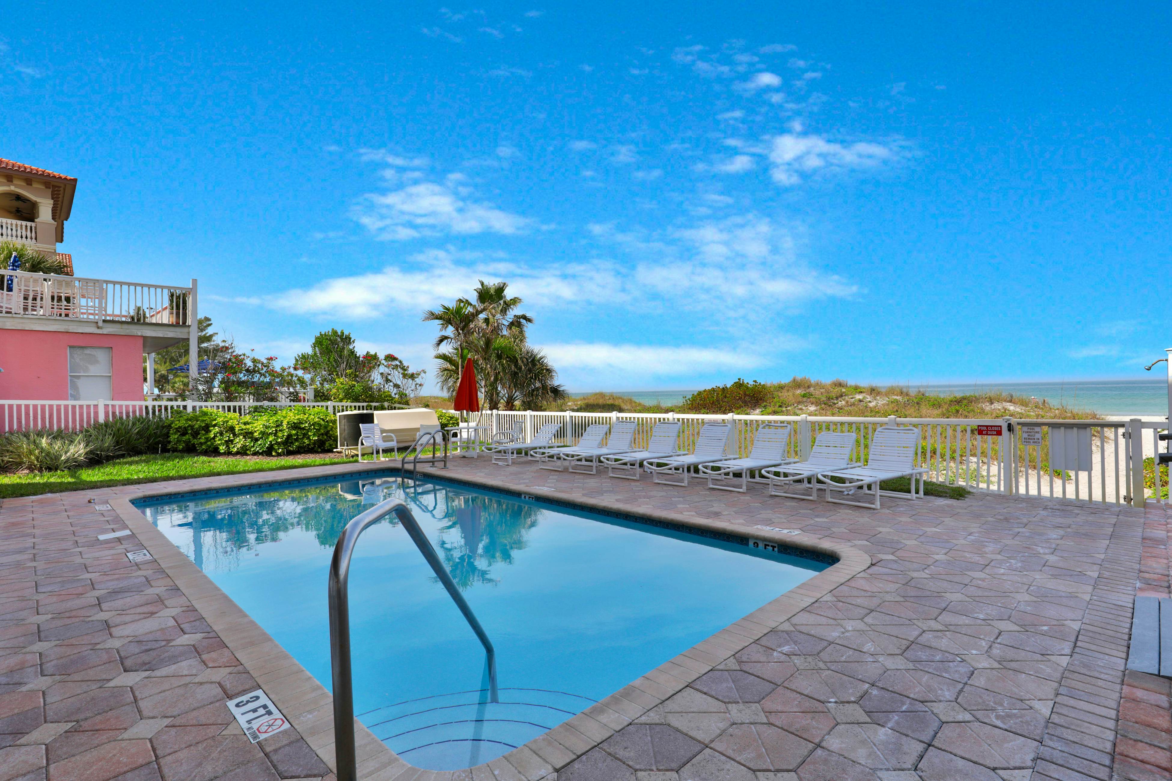 Oceanfront condo with WiFi, pool & views - walk to dining & attractions