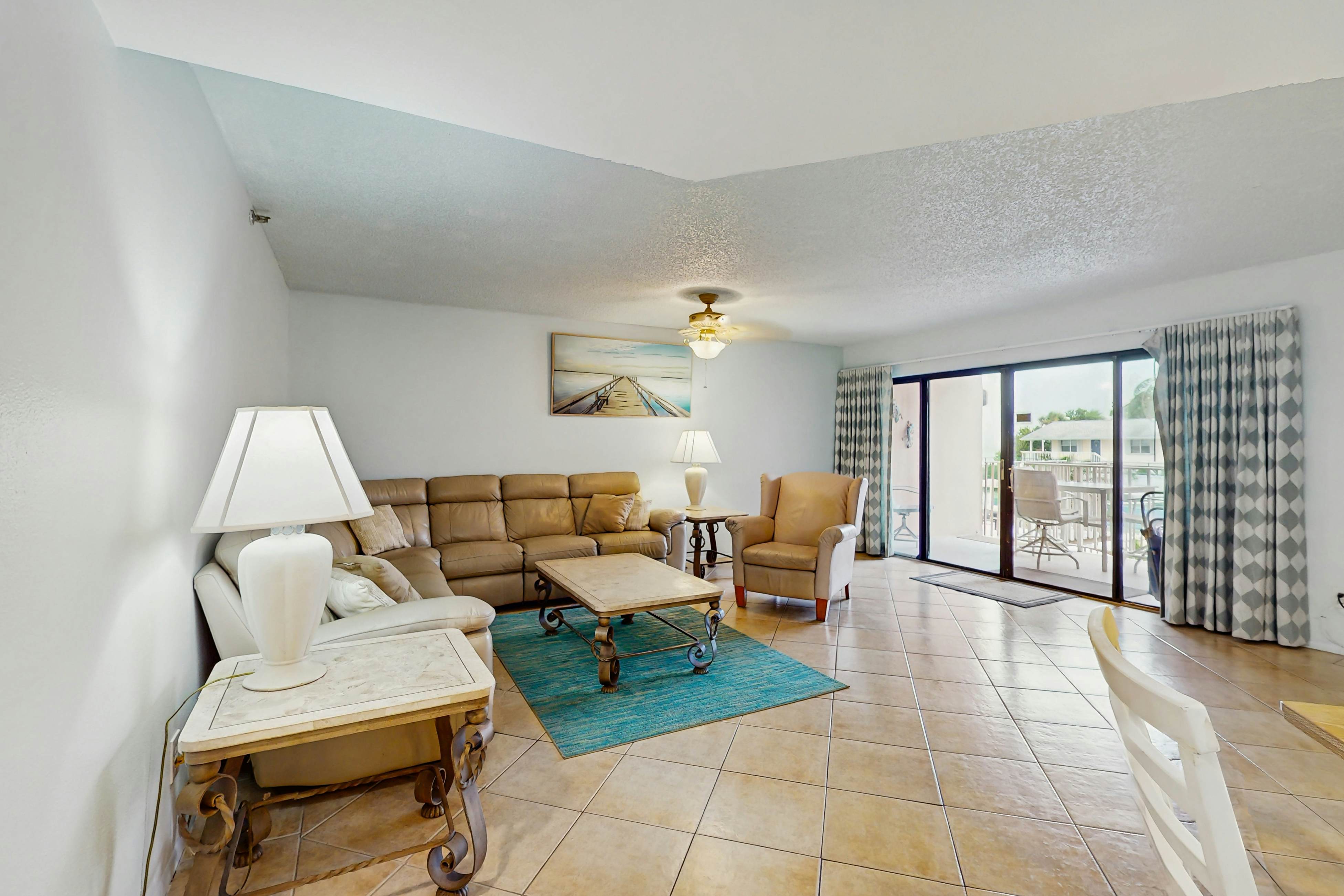 Waterfront condo with updated amenities, heated pool, hot tub, & tennis