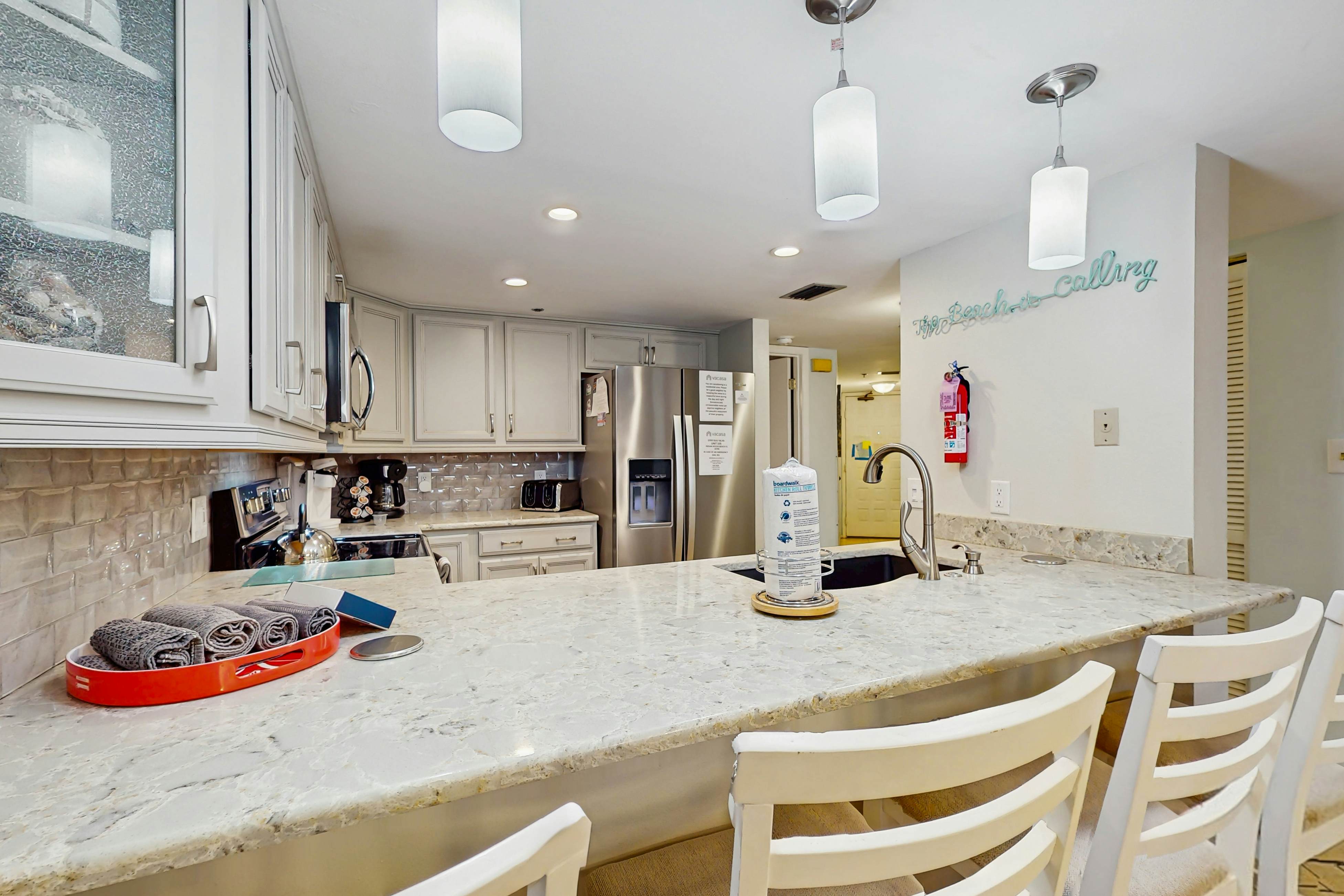 Waterfront condo with updated amenities, heated pool, hot tub, & tennis