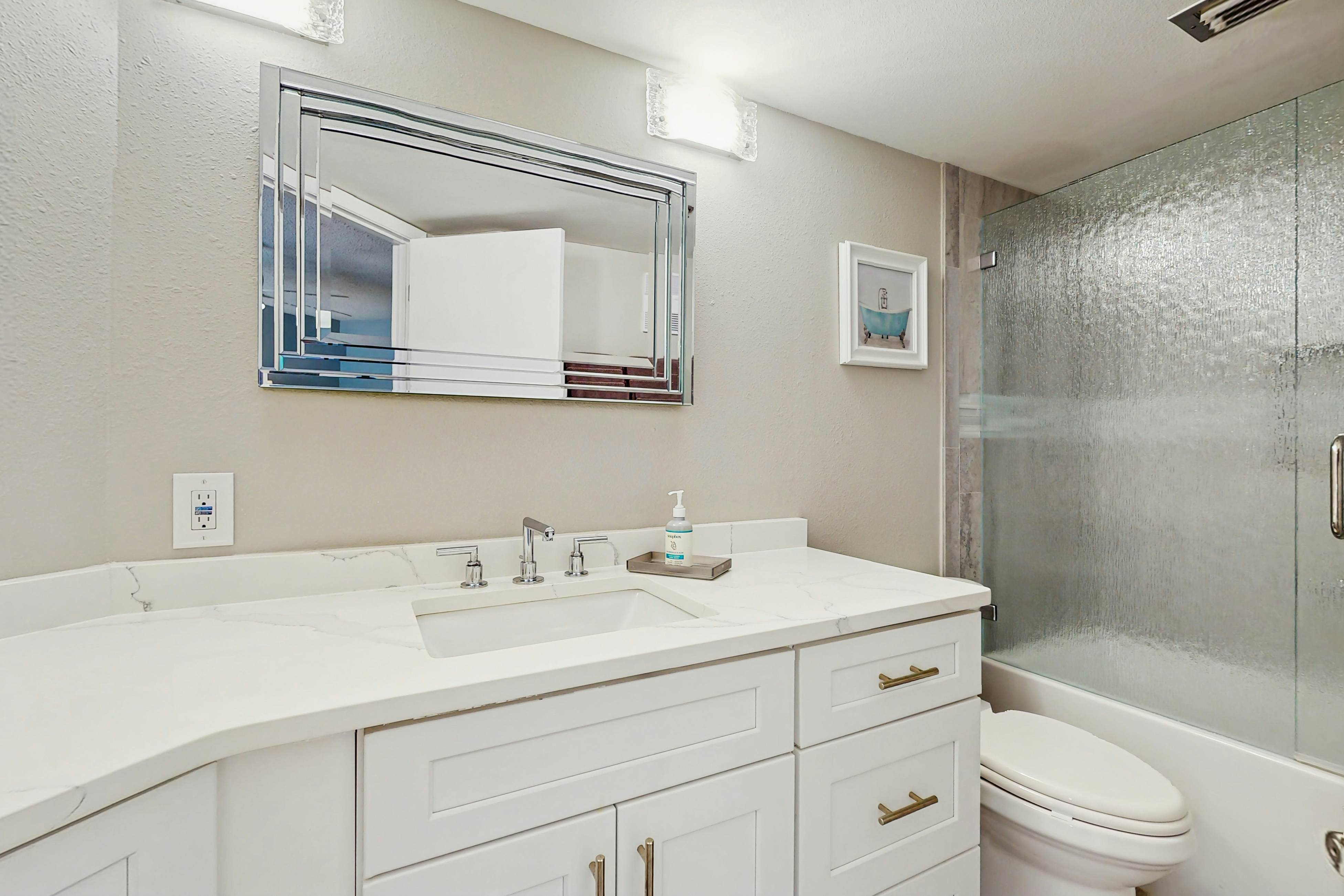 Waterfront condo with updated amenities, heated pool, hot tub, & tennis