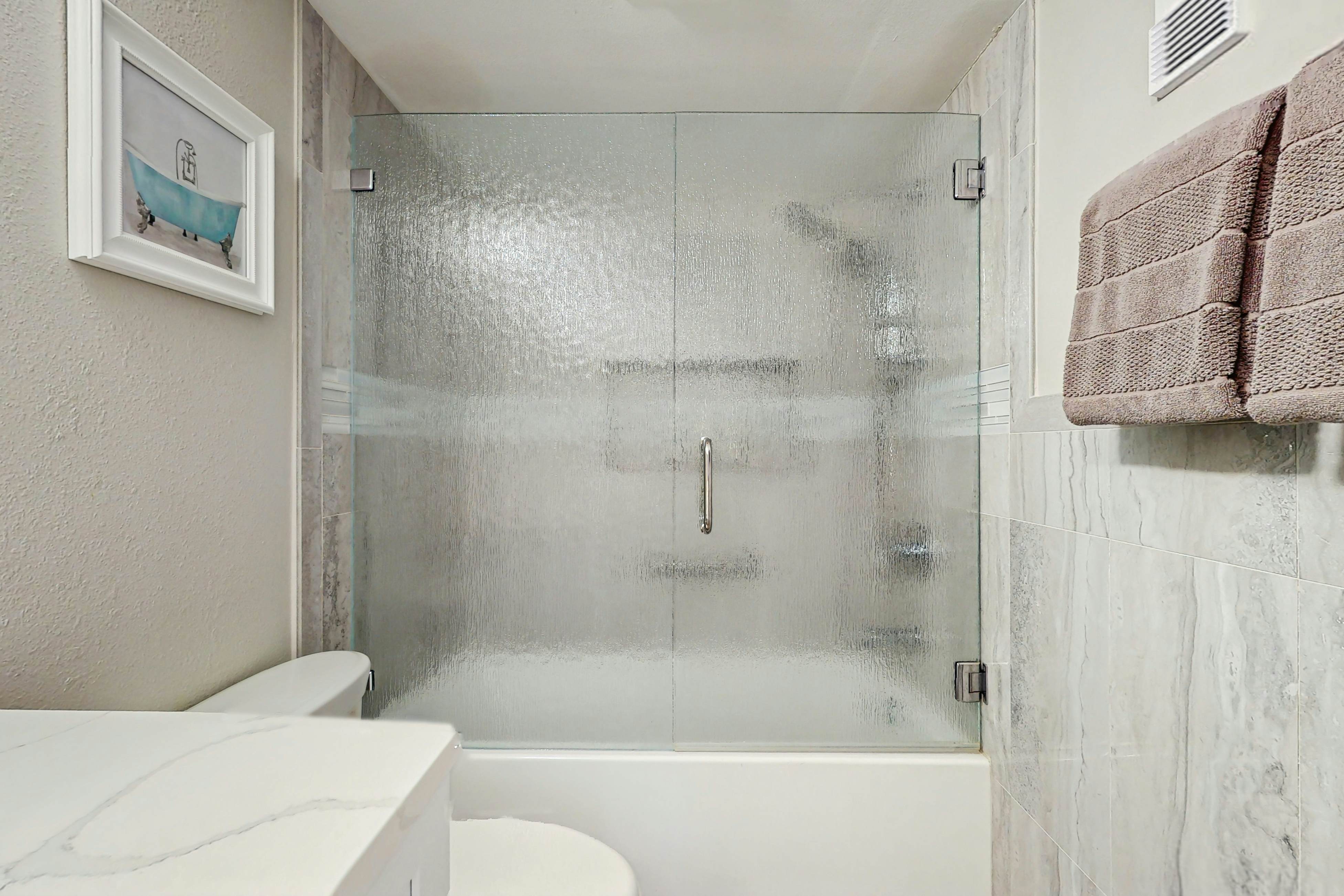 Waterfront condo with updated amenities, heated pool, hot tub, & tennis