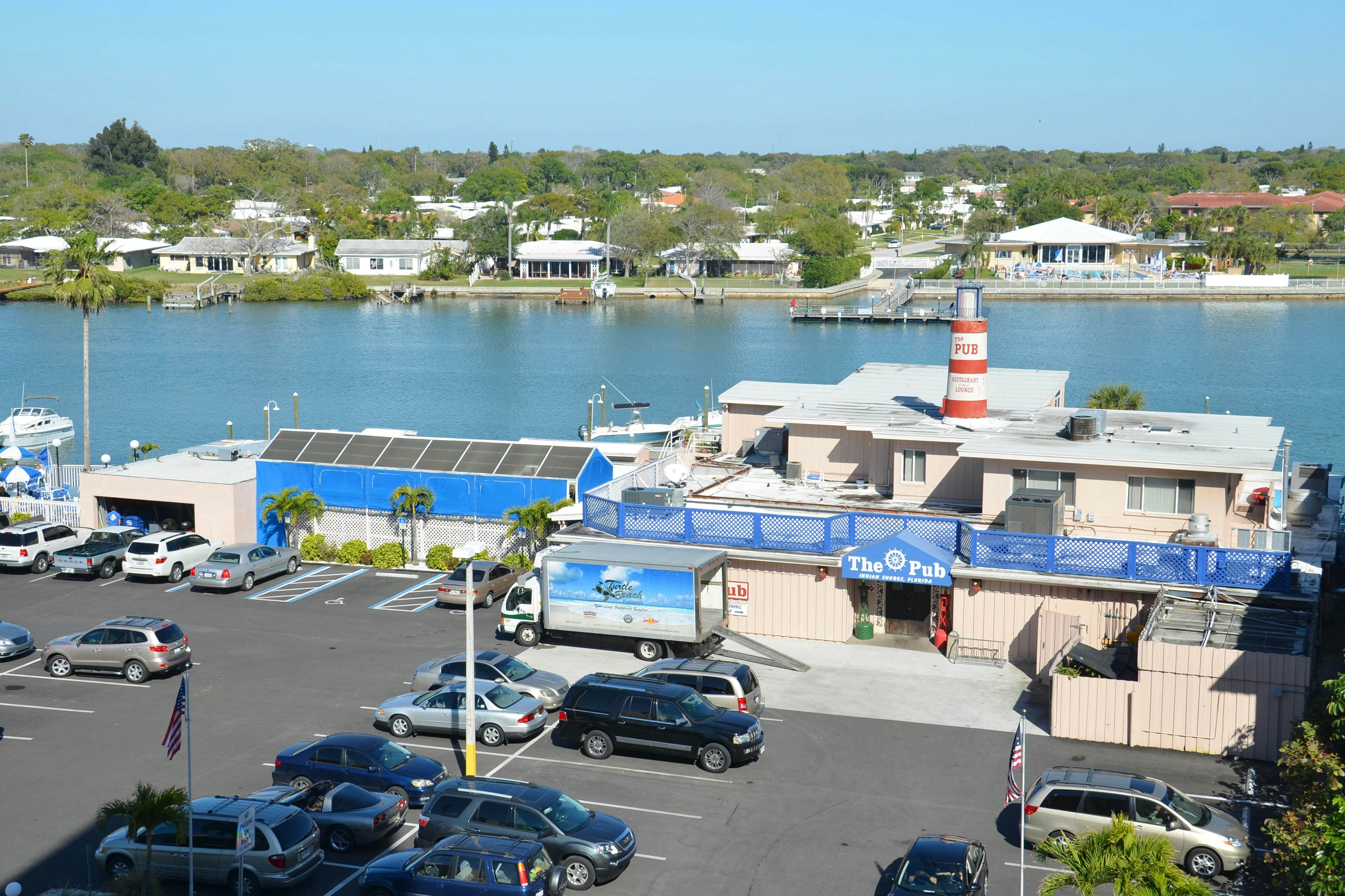 Waterfront condo with updated amenities, heated pool, hot tub, & tennis