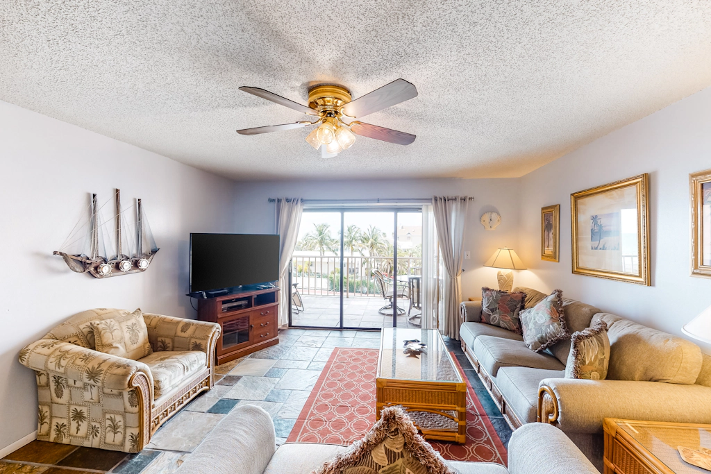 Waterfront condo with pool hot tub tennis and beach access