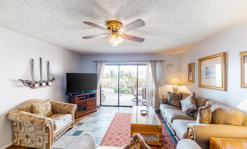 Waterfront condo with pool hot tub tennis and beach access